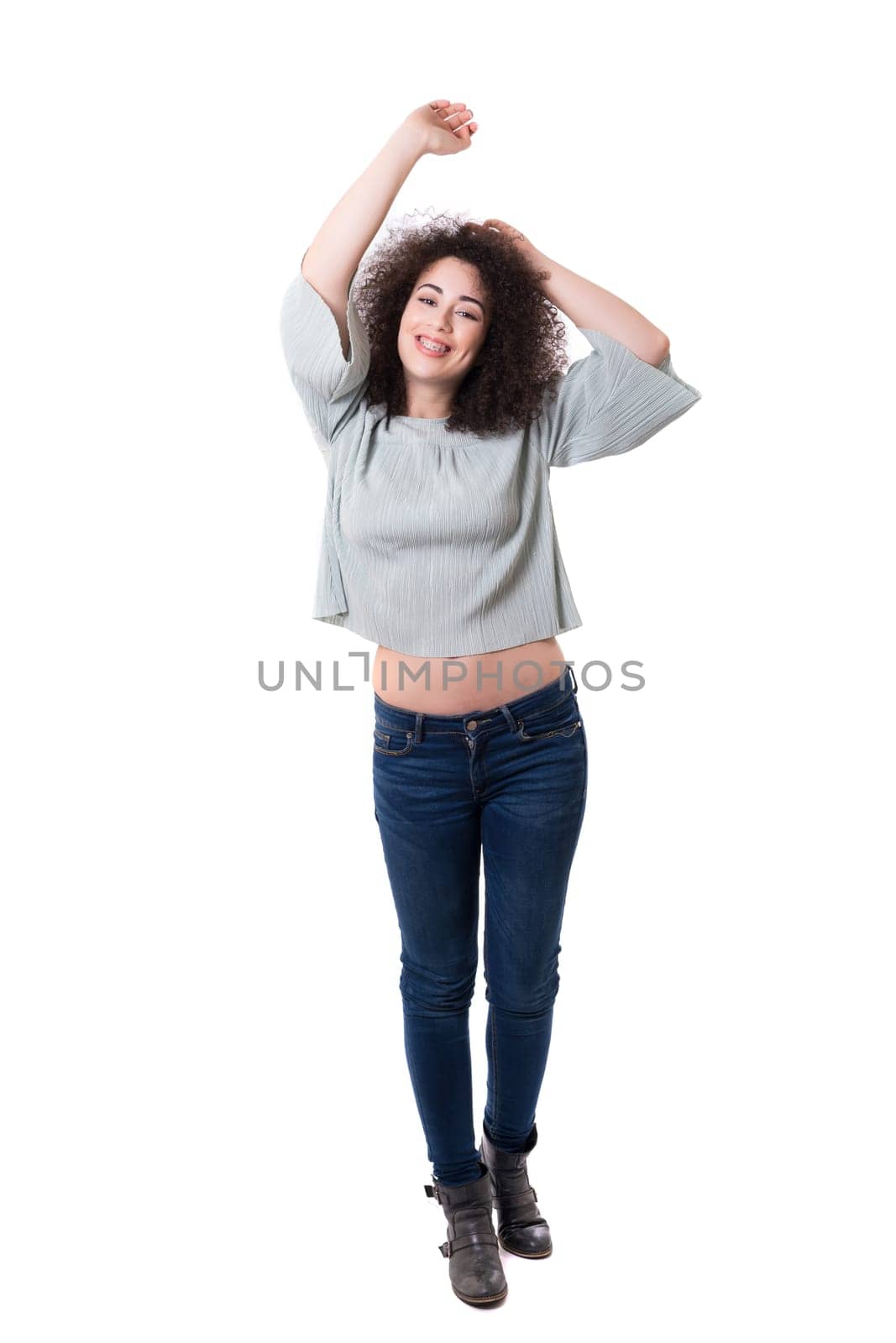 Happy young woman - who weares braces - posing isolated over white