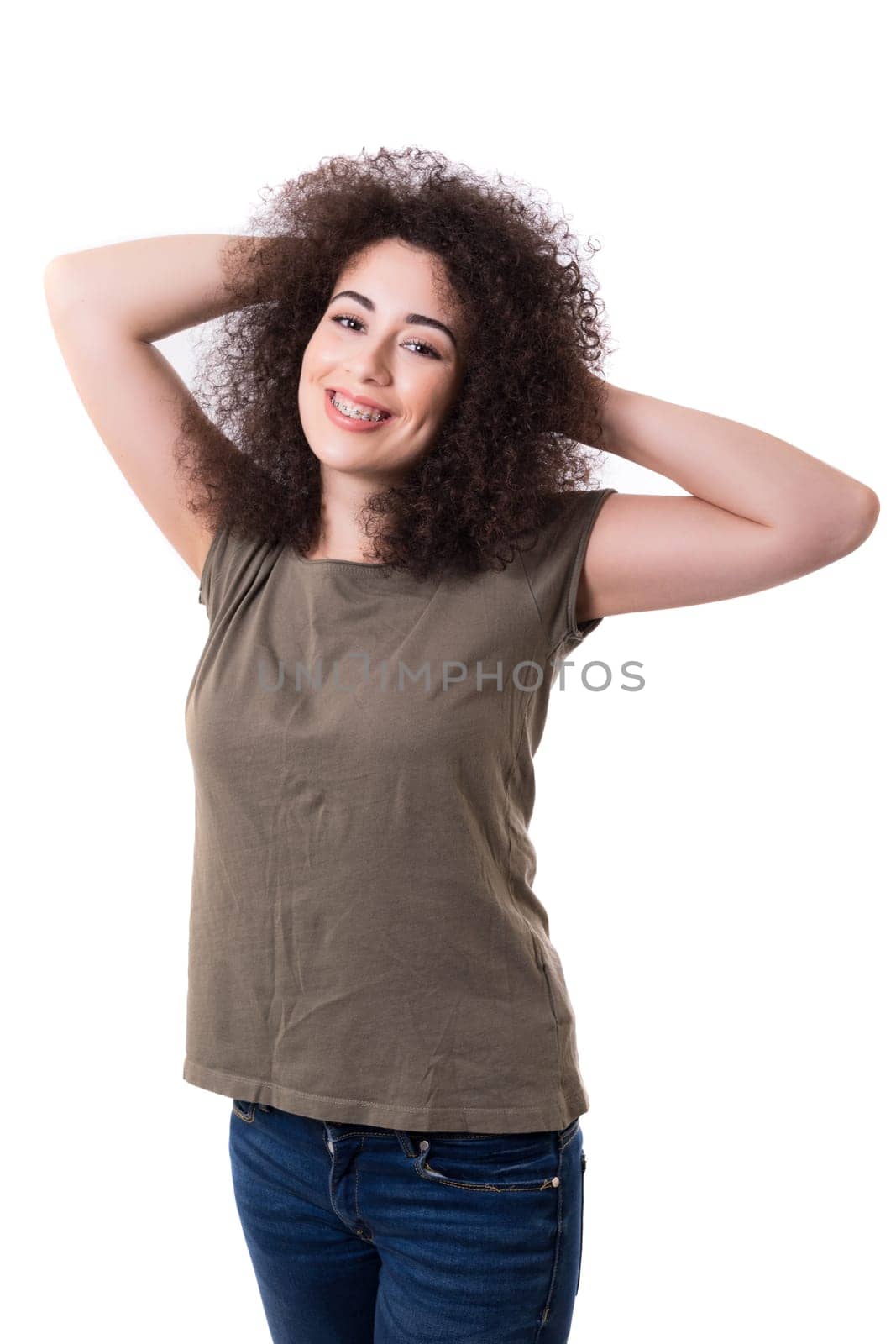 Happy young woman - who weares braces - posing isolated over white