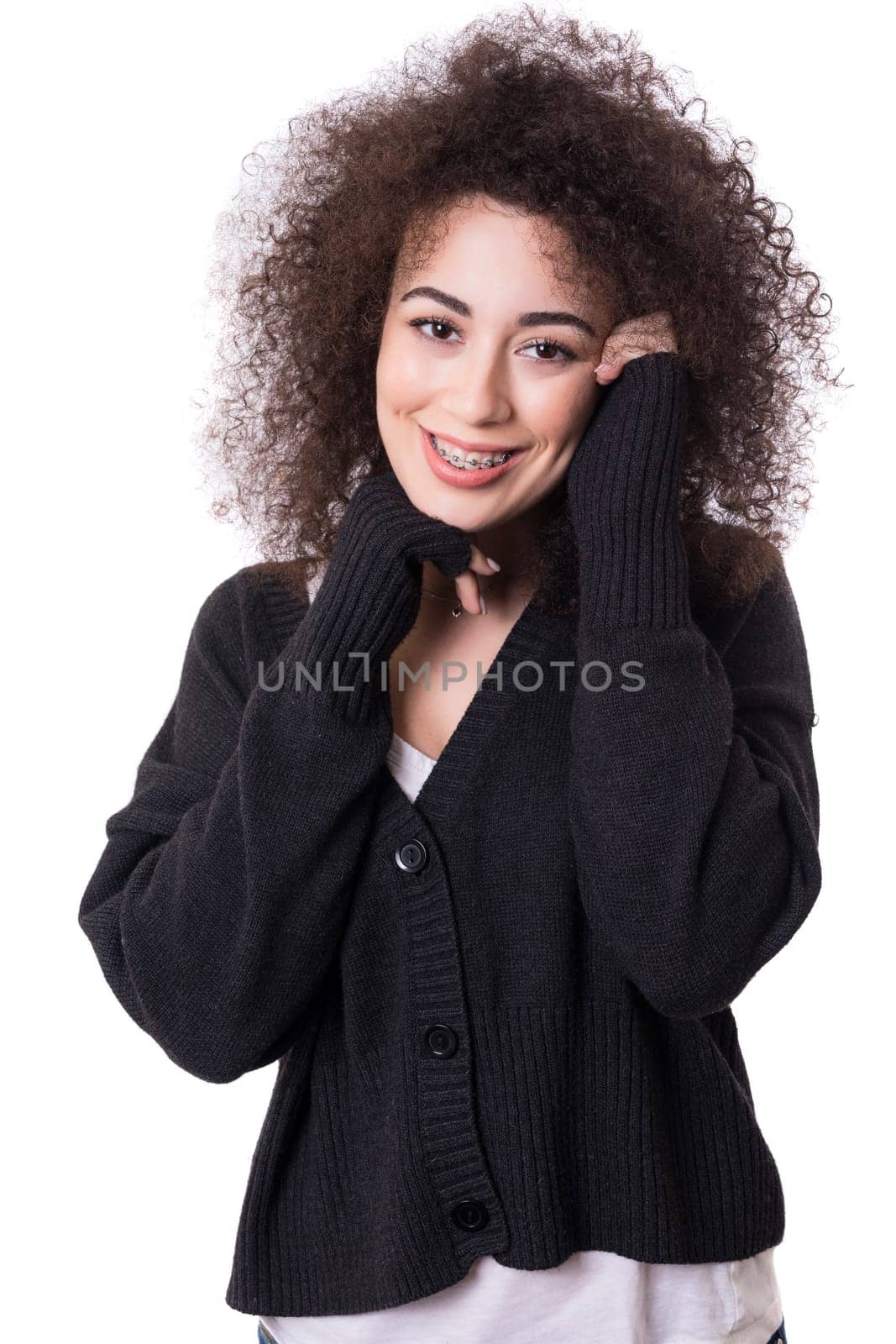Happy young woman - who weares braces - posing isolated over white