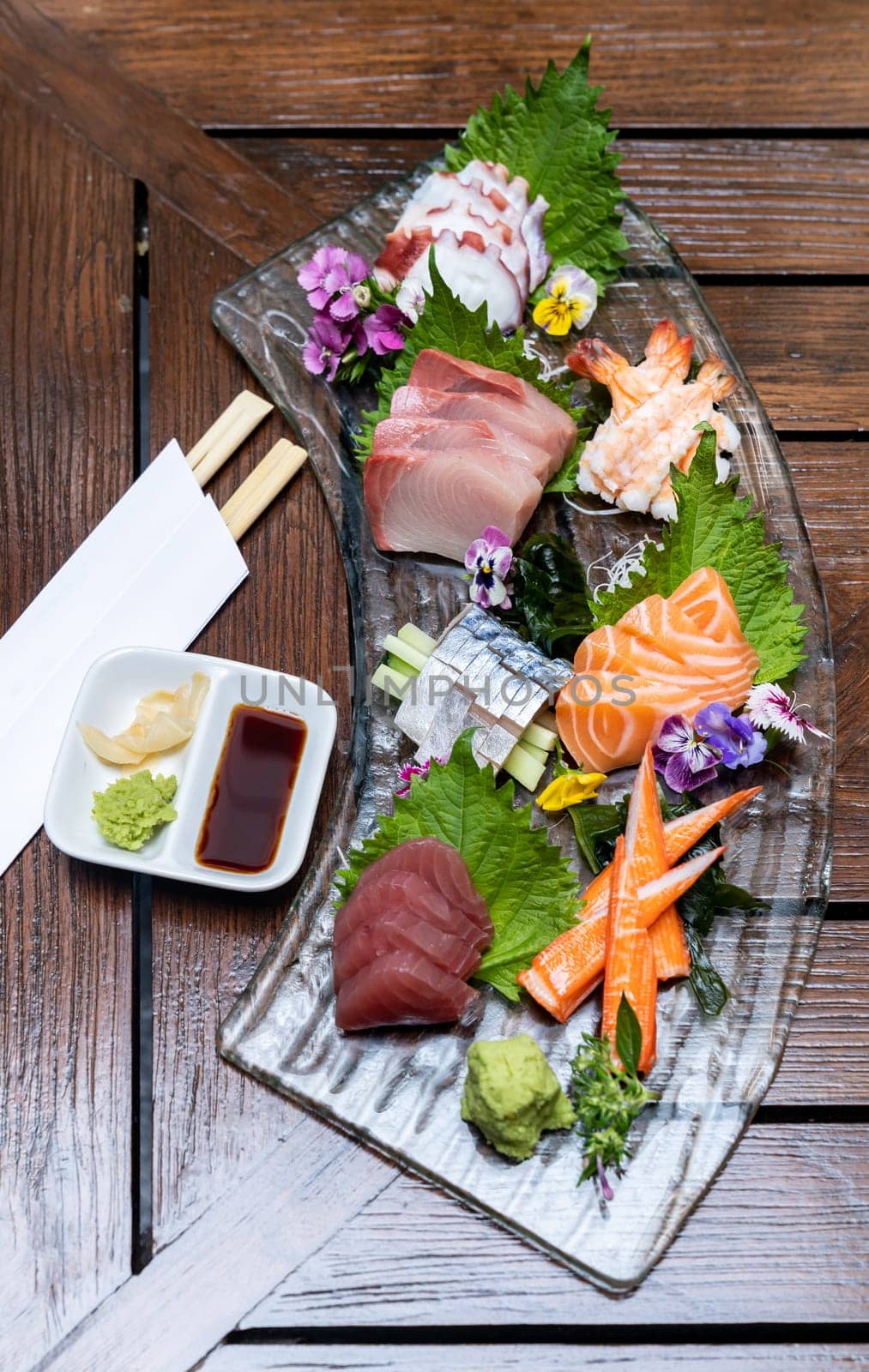 Variety of gourmet Sashimi set japanese freshness cuisine Salmon Tuna Otoro Saba Hamachi Octopus and shrimp meat. Restaurant gastronomy food and drink consumerism concept.