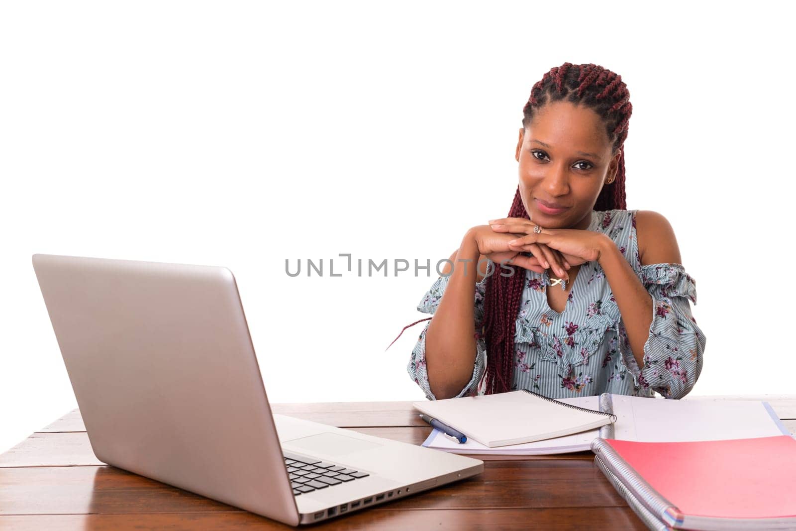 Young african student working with her laptop, isolated over a white background