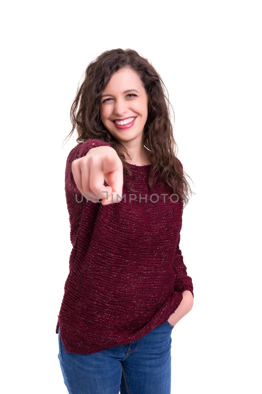 Young beautiful woman pointing at you, isolated over white