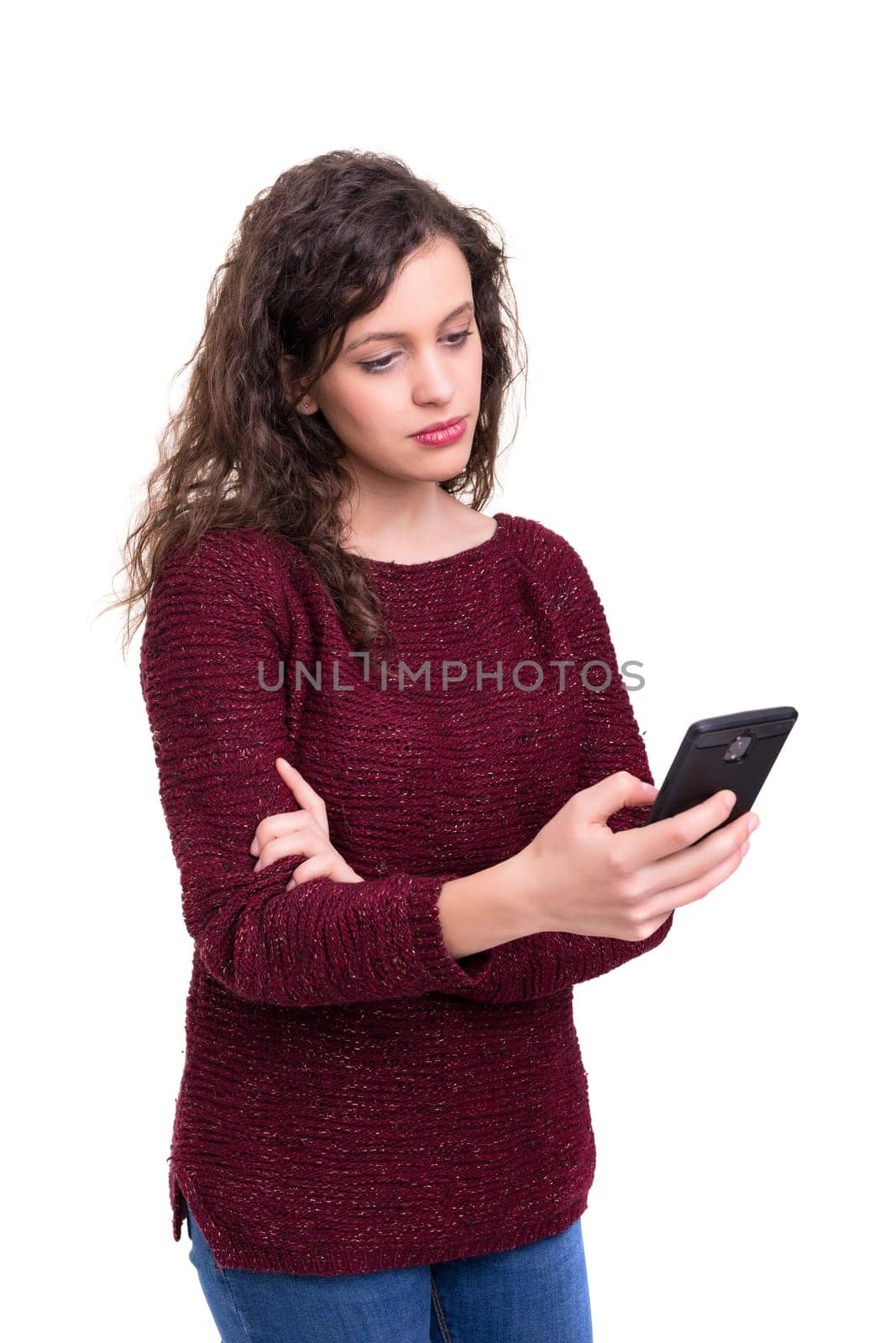 Young beautiful woman at the phone, isolated over a white background