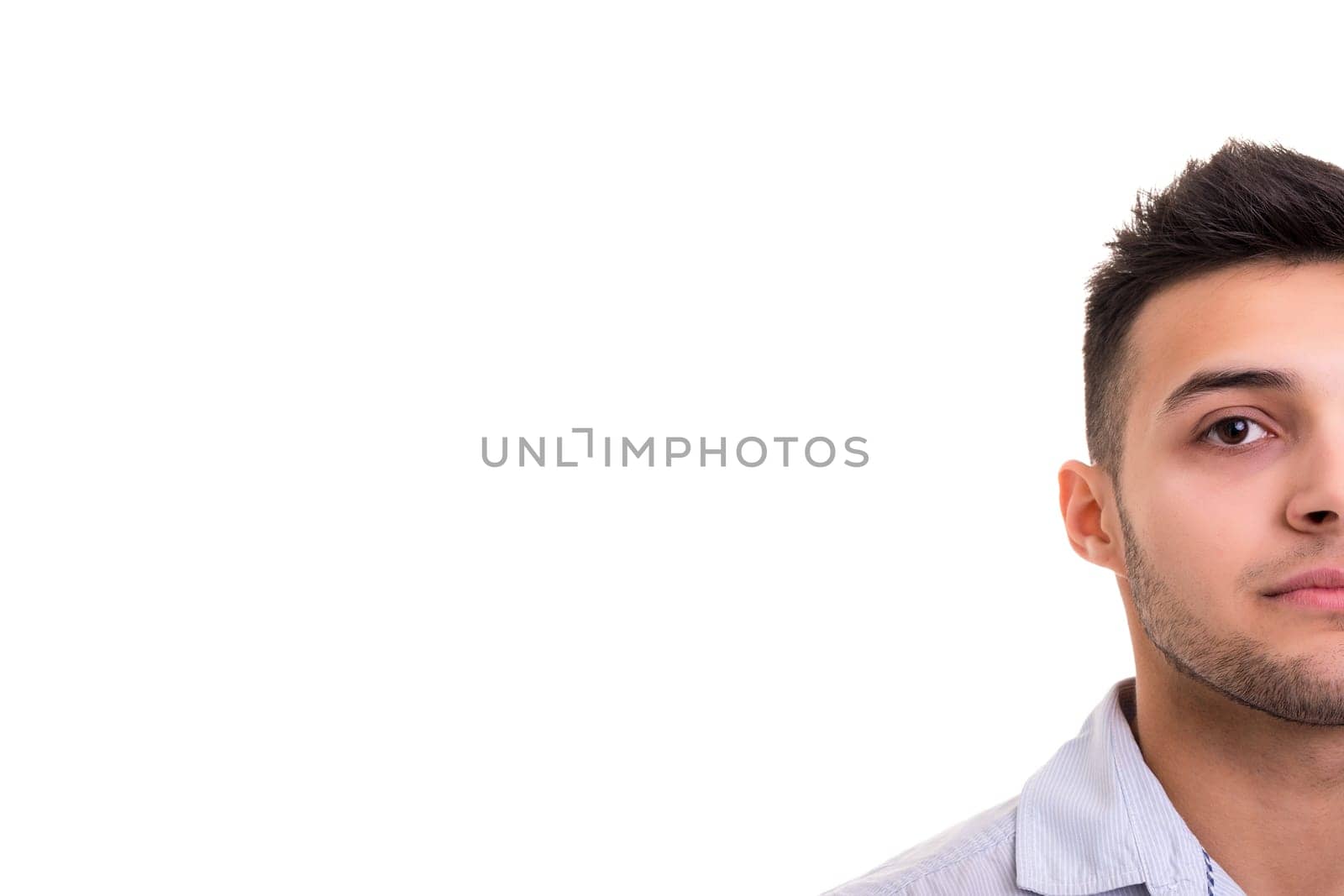 Studio picture of a young and handsome man posing isolated