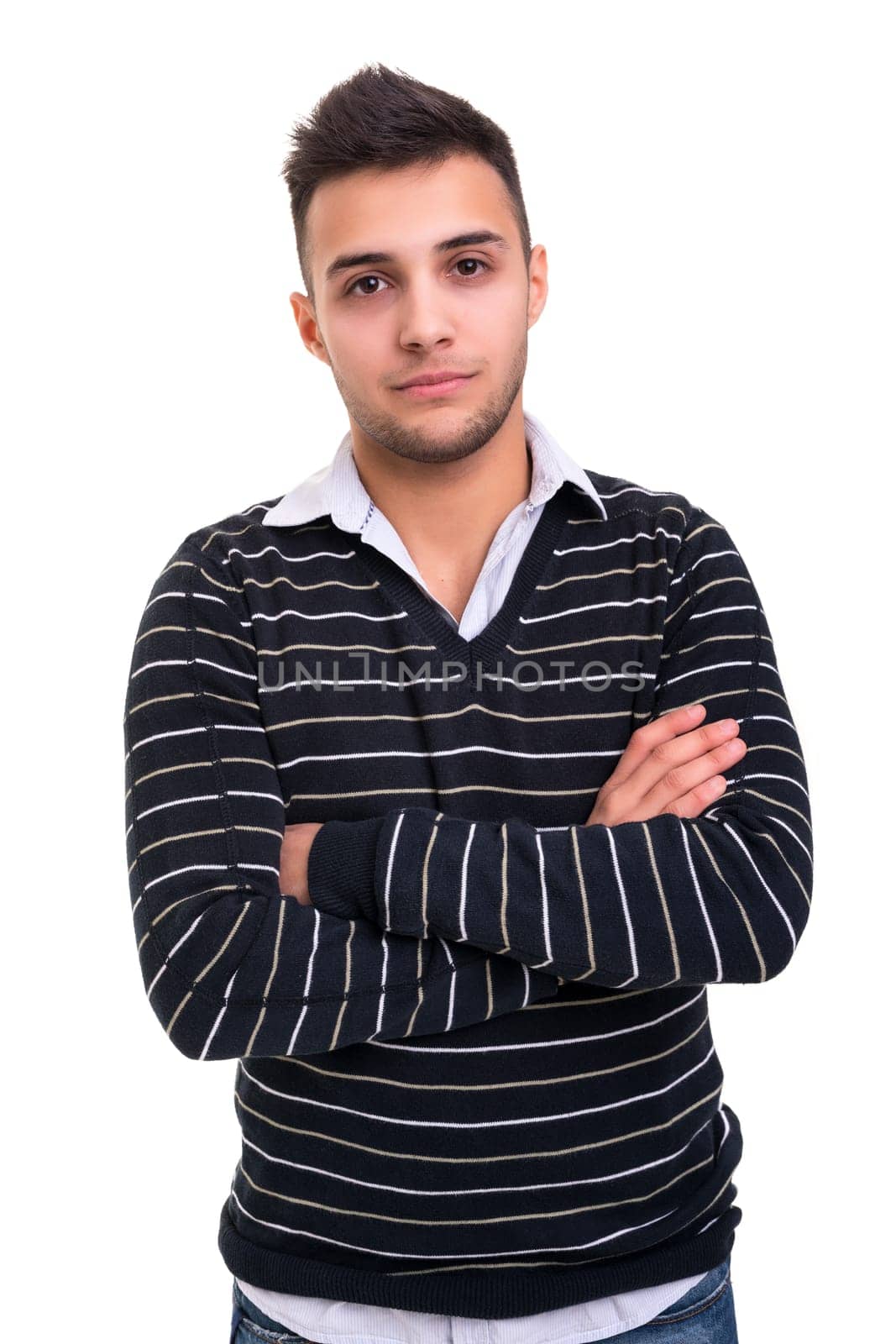 Studio picture of a young and handsome man posing isolated