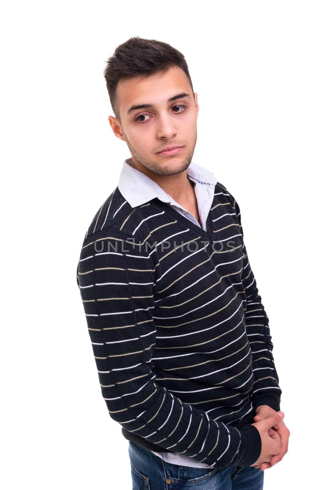 Studio picture of a young and handsome man posing isolated
