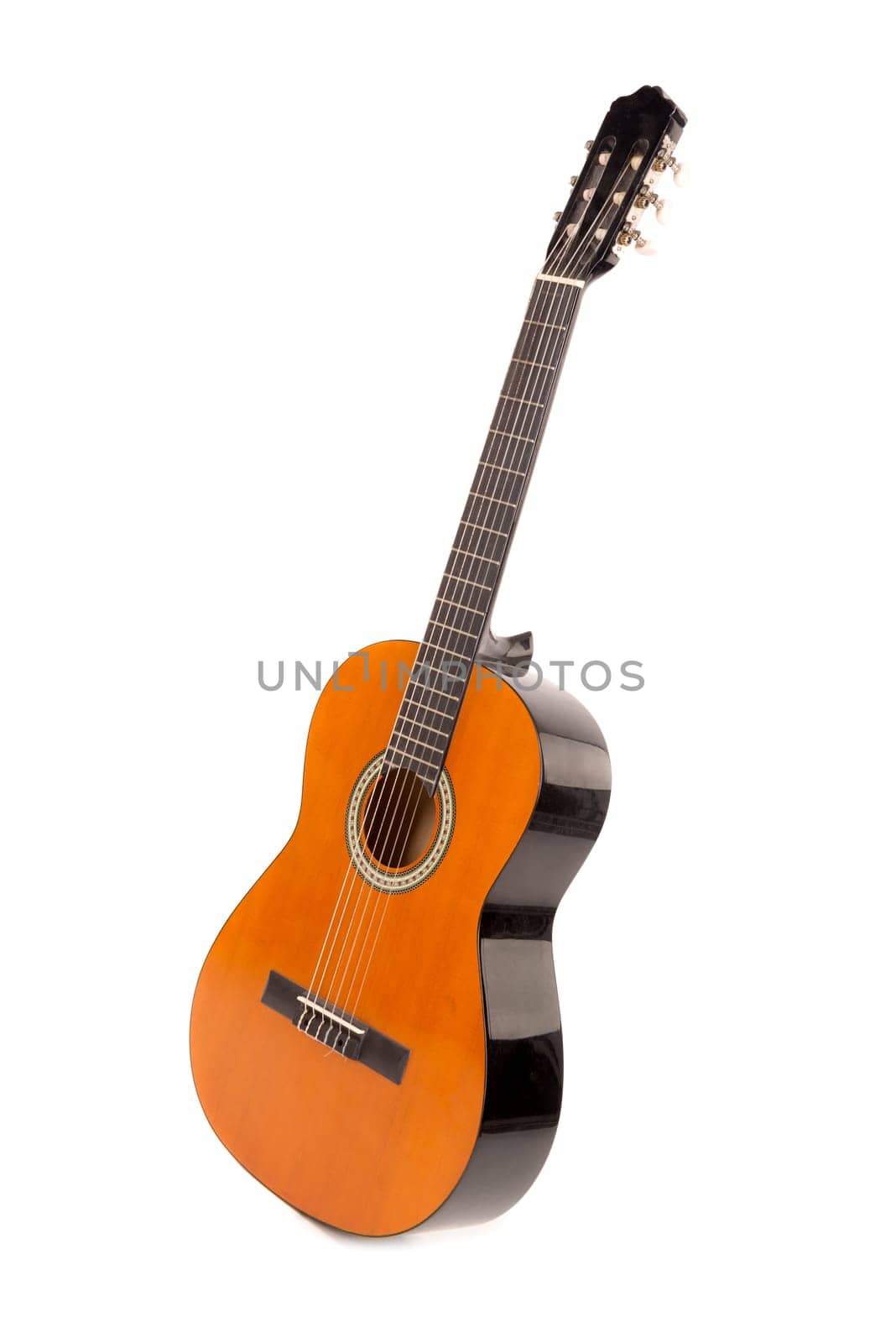 Acoustic guitar isolated in a white background
