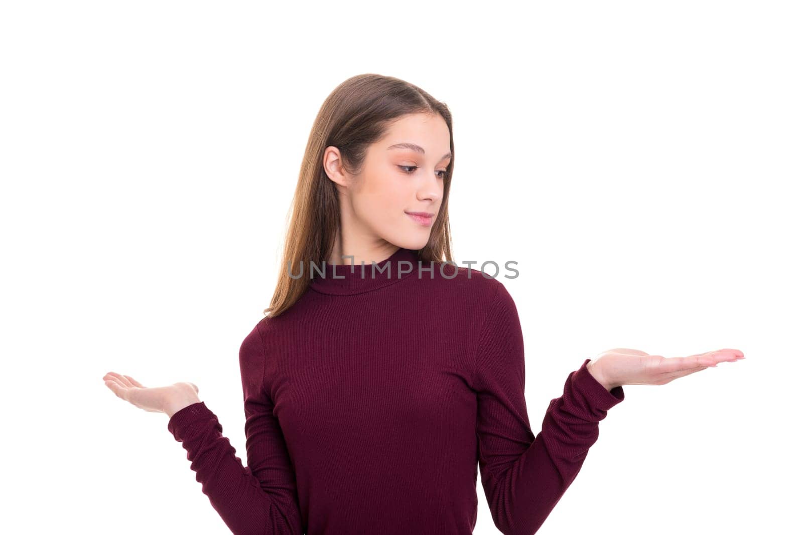 Young beautiful woman presenting your product, isolated over white background