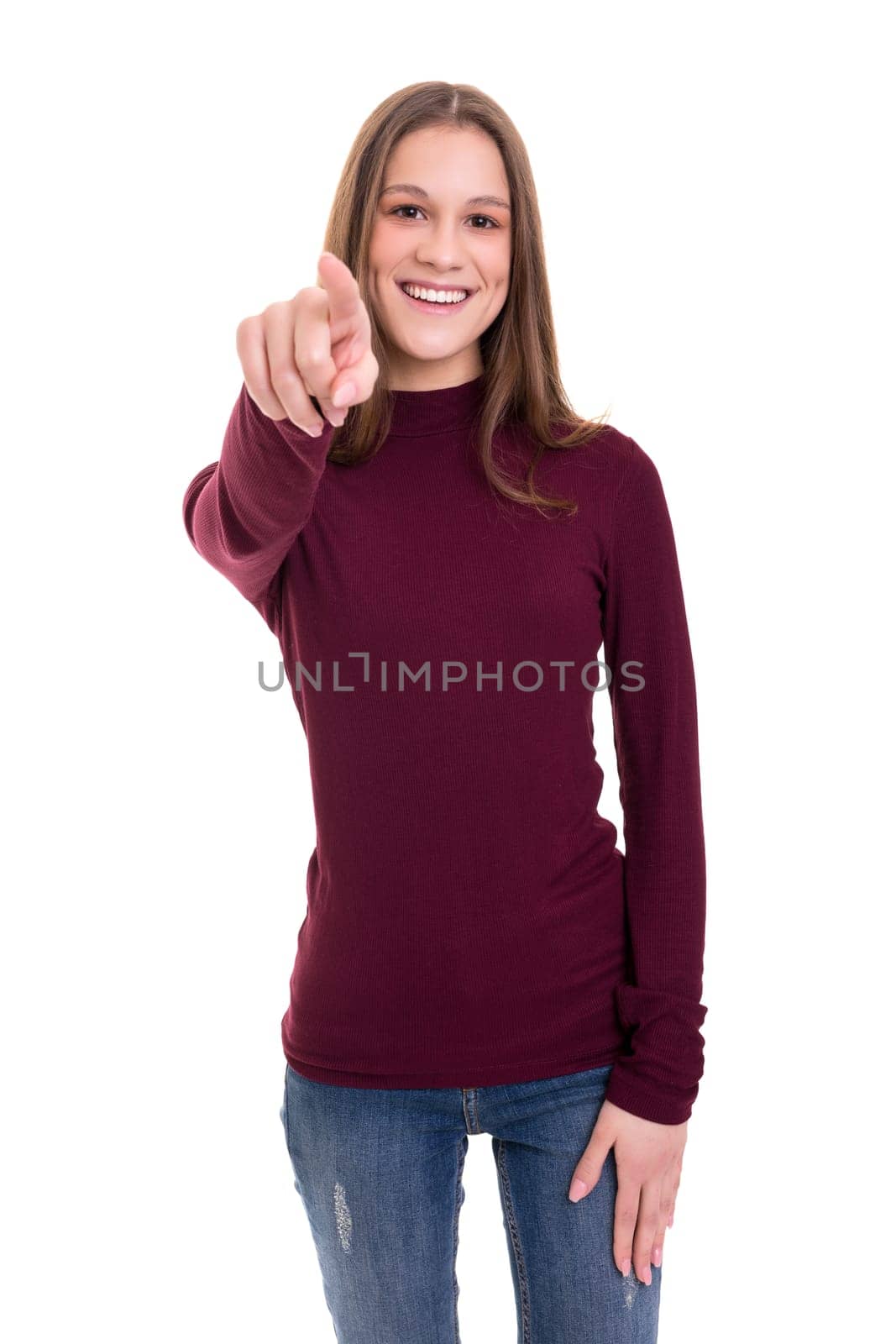 Young beautiful woman pointing at you, isolated over white