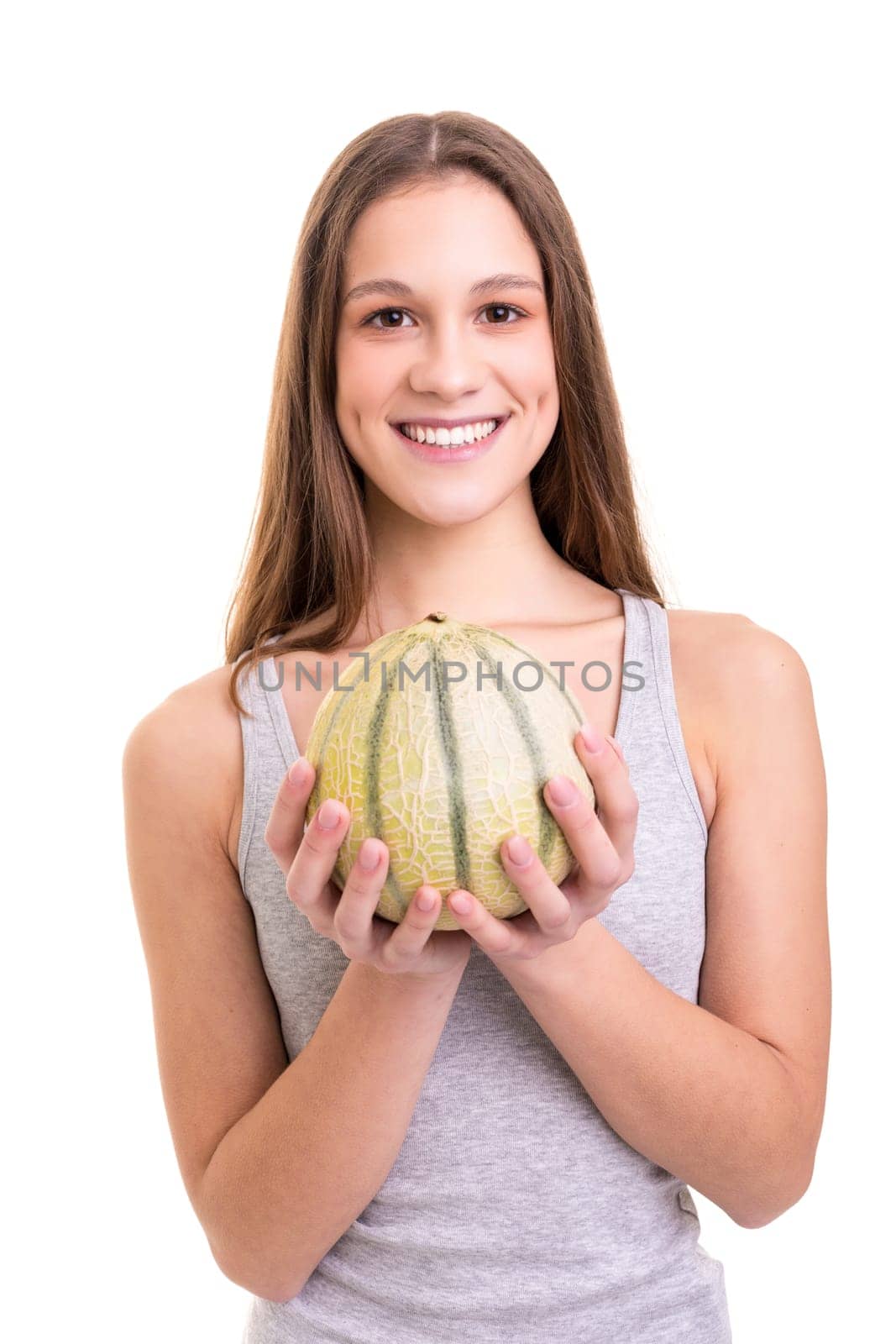 Young woman holding a fresh watermelon, isolated over white background
