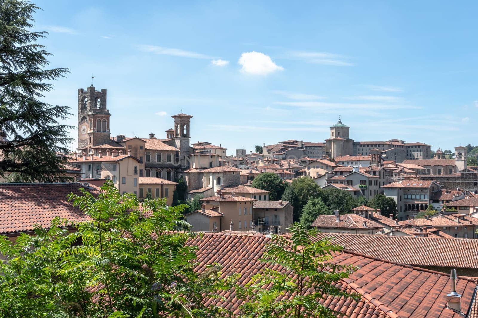 Upper town. Bergamo, Italy. Landscape at the city center, the old towers and the clock towers from the ancient fortress. Bergamo, ITALY - August 19, 2020.