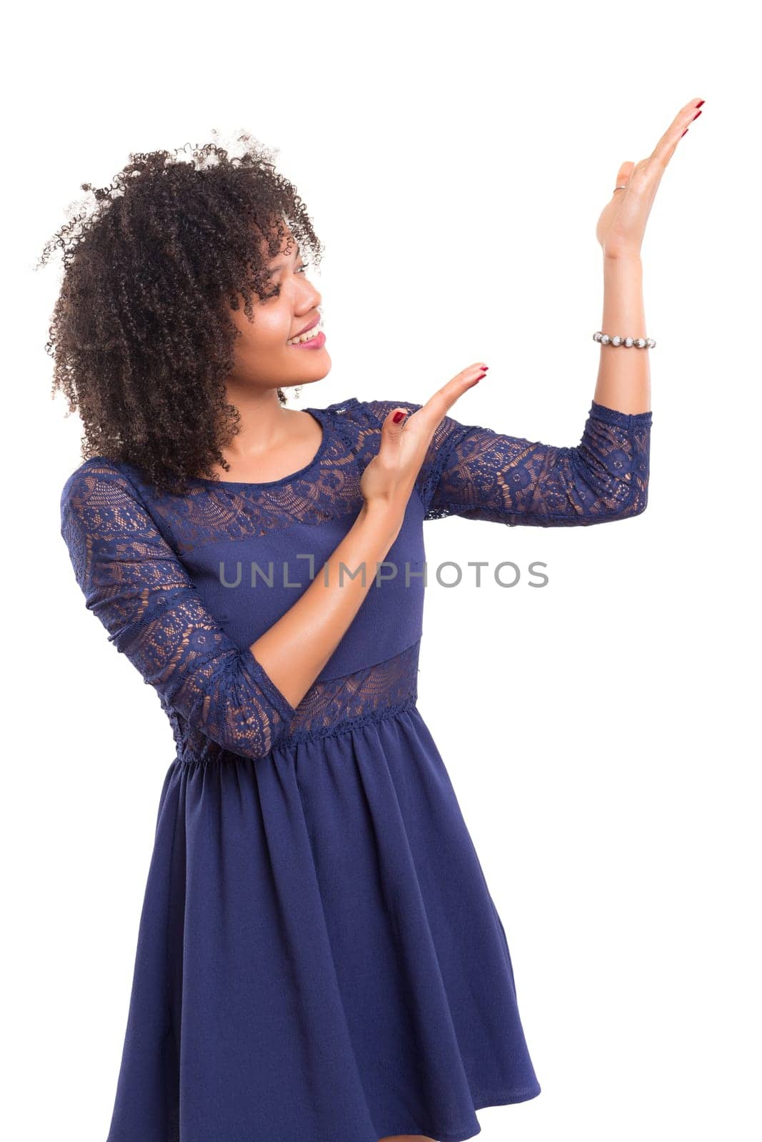 Young beautiful african woman presenting your product, isolated over white background