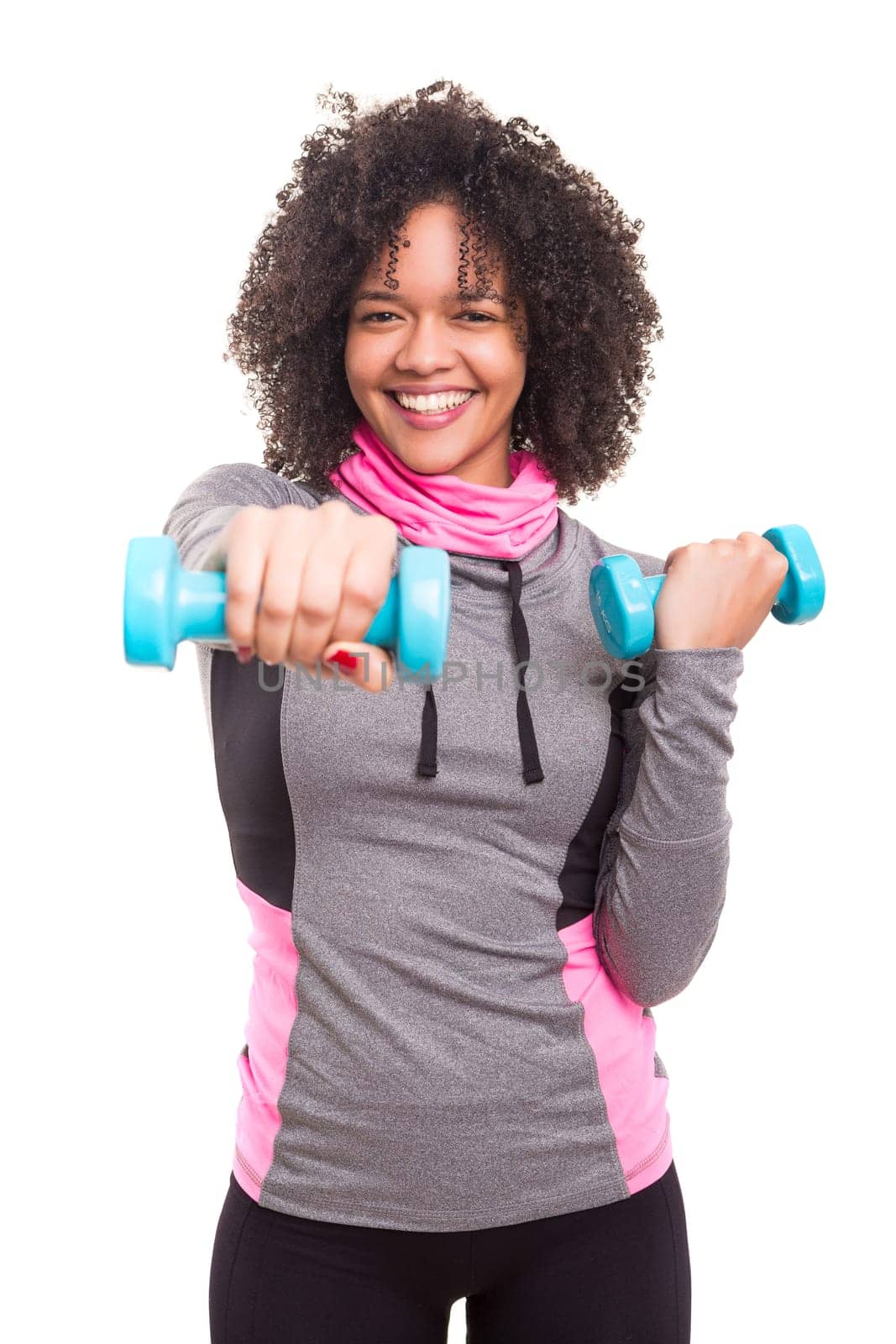Studio shot of a beautiful african woman exercising