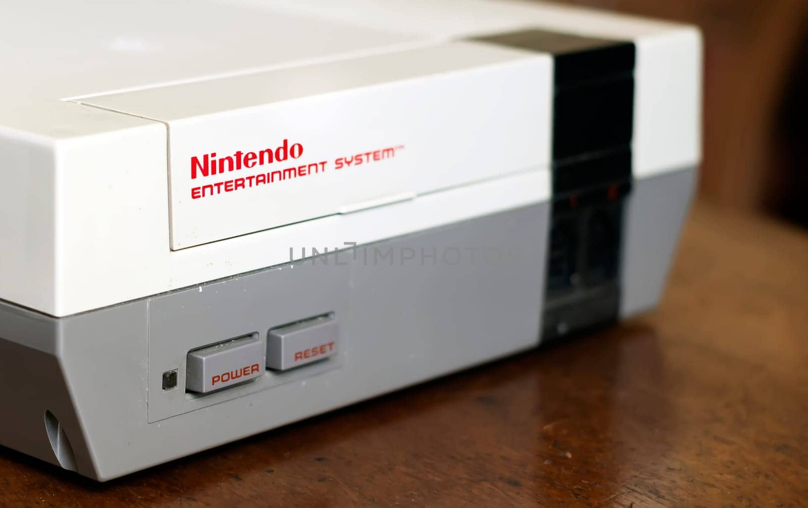 Rome, Italy, December 23, 2020: a classic Nintendo Entertainment System video games console. 8-bit technology. Video games in the 90s