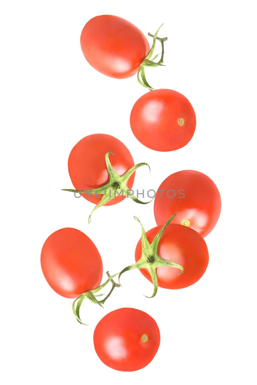 Isolated vegetables. Seven whole tomatoes in the air on white with clipping path as package design element. Full depth of field. Food levitation concept