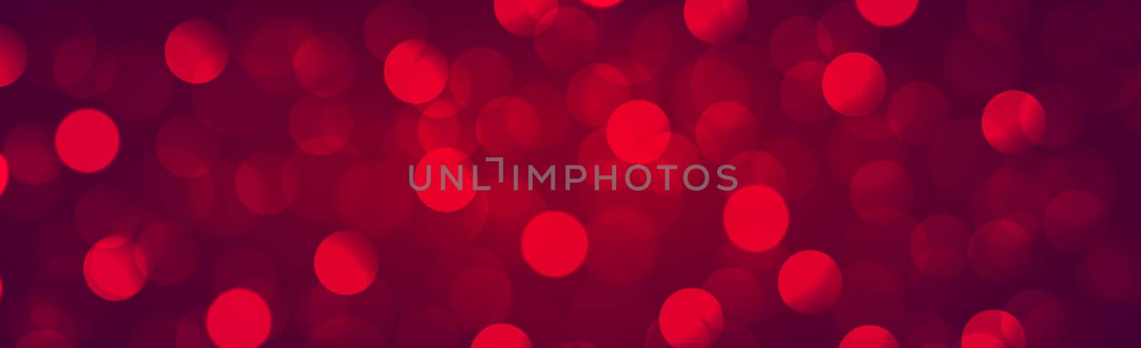 Multicolored blurry bokeh on a red background - Panorama