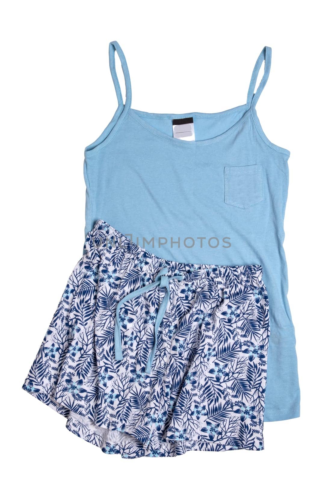 Night gown isolated. Close-up of blue female cotton sexy nightwear summer set of shorts and a top with spaghetty straps isolated on a white background. Fashionable night wear or nighties.