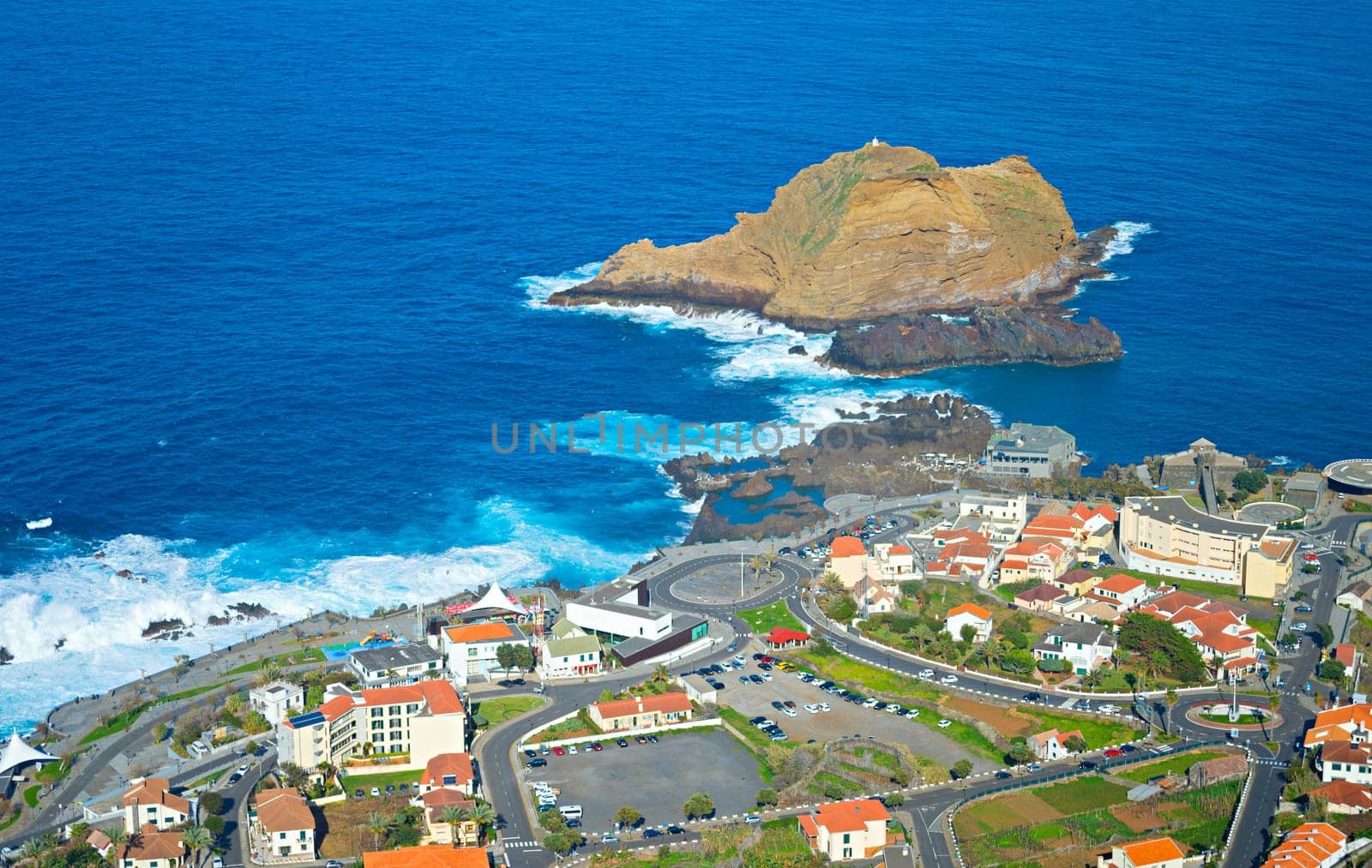Aerial view of Porto Moniz town, famous for its natural volcanic lava pools. Madeira
