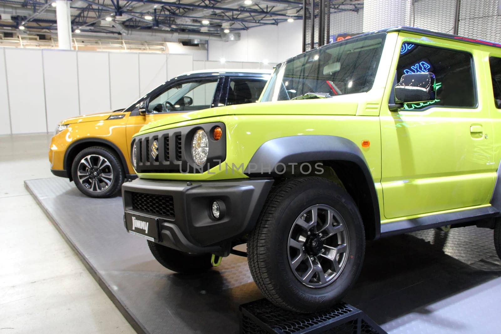 Modern Suzuki Vitara car is presented at exhibition in Kiyv. Japanese brand auto Suzuki. Yellow Suzuki Vitara car
