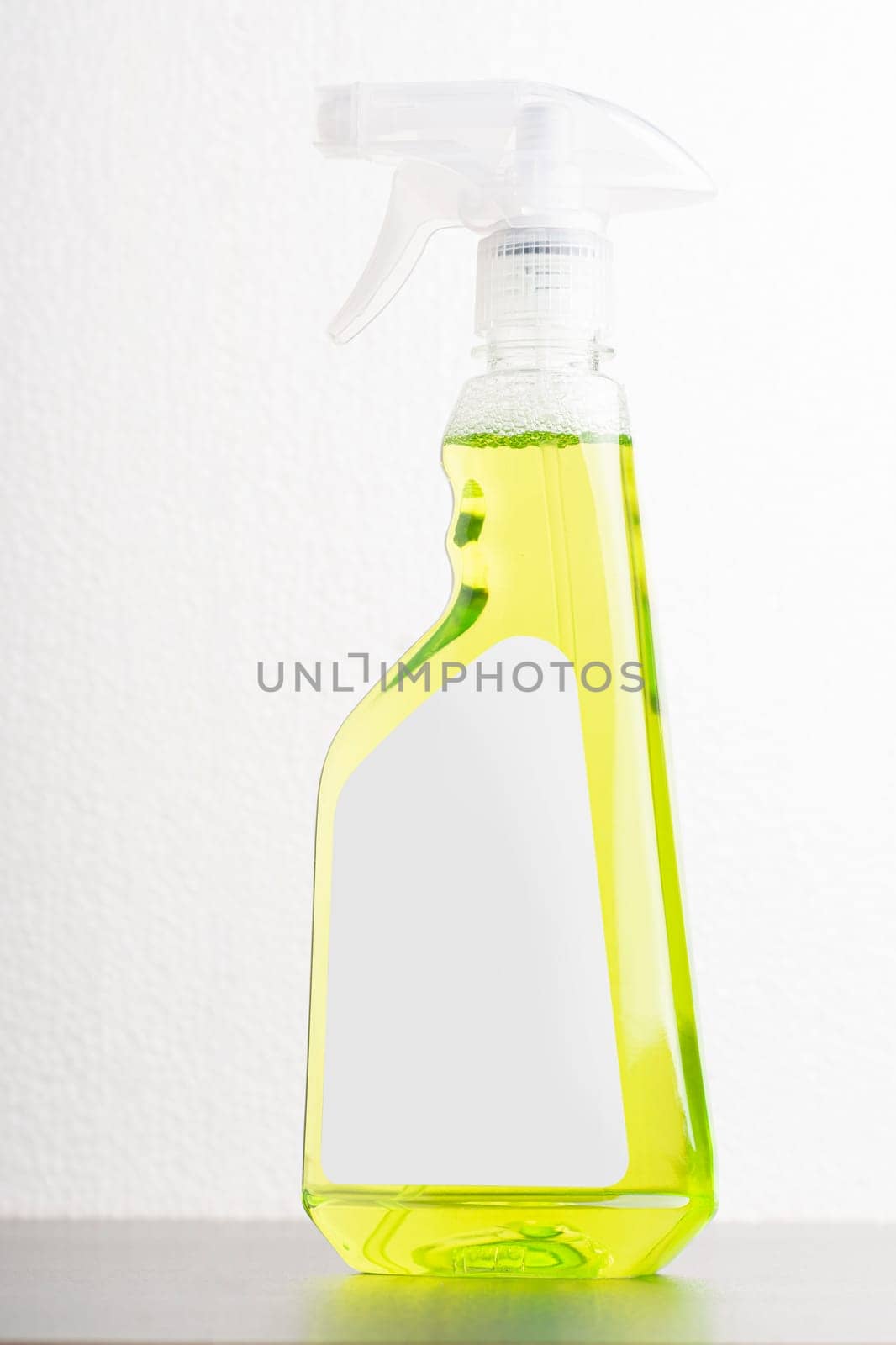 Cleaning liquid bottle in front of  light gray background, editable mock-up series template ready for your design, label selection path included.