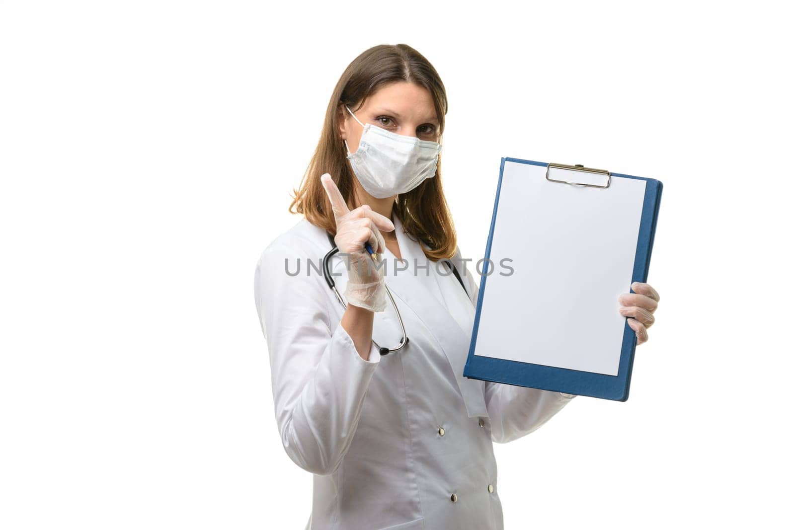 Girl doctor holds a tablet in her hands and shows a warning thumbs up