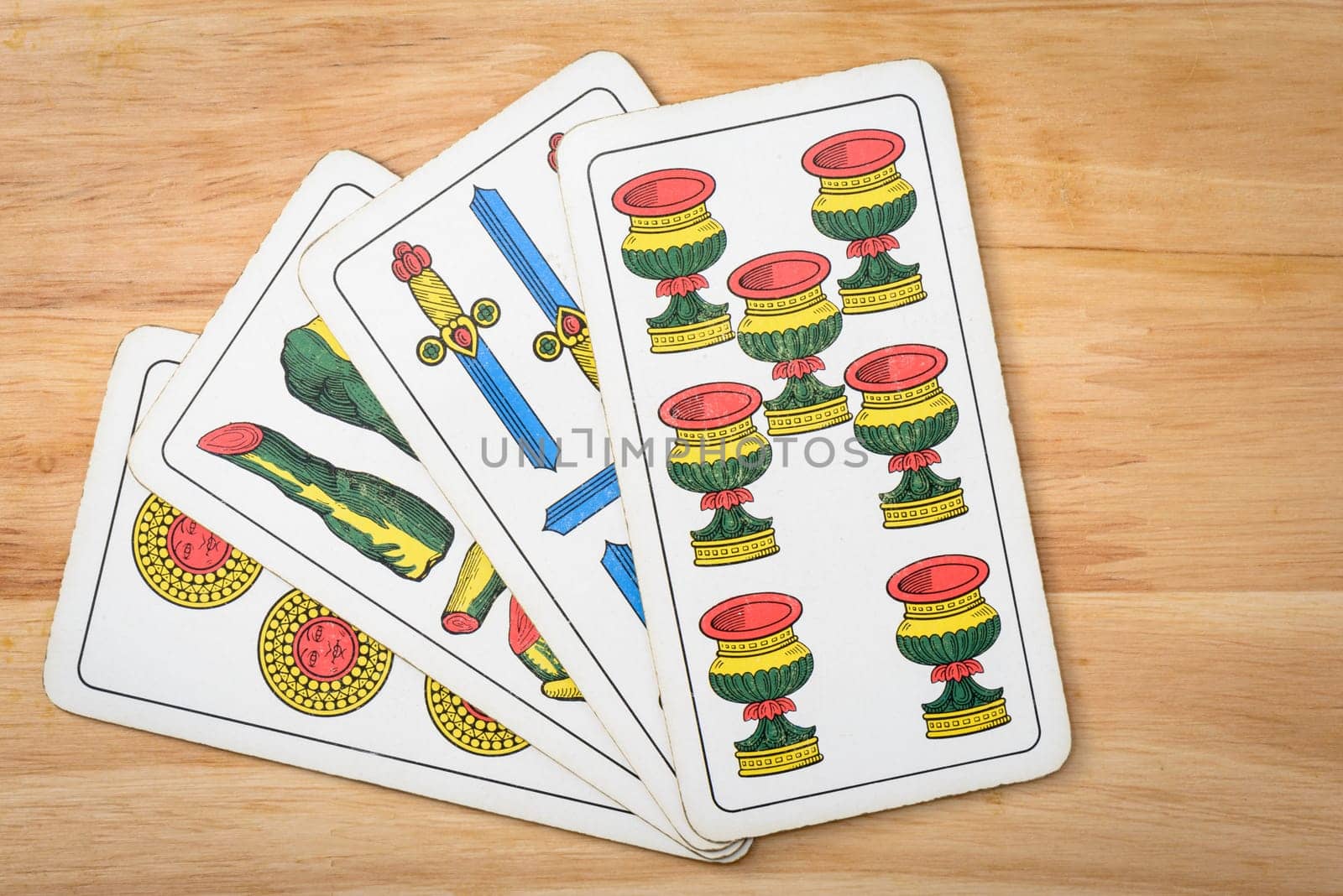 Primiera italian card on a wood background