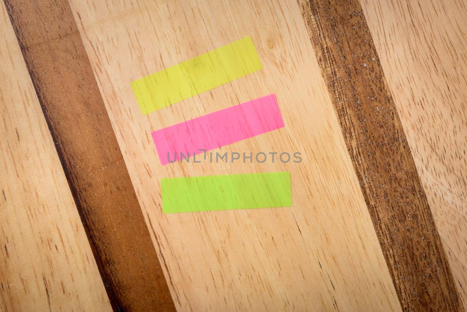 Notes three colours horizontal mix on wood background
