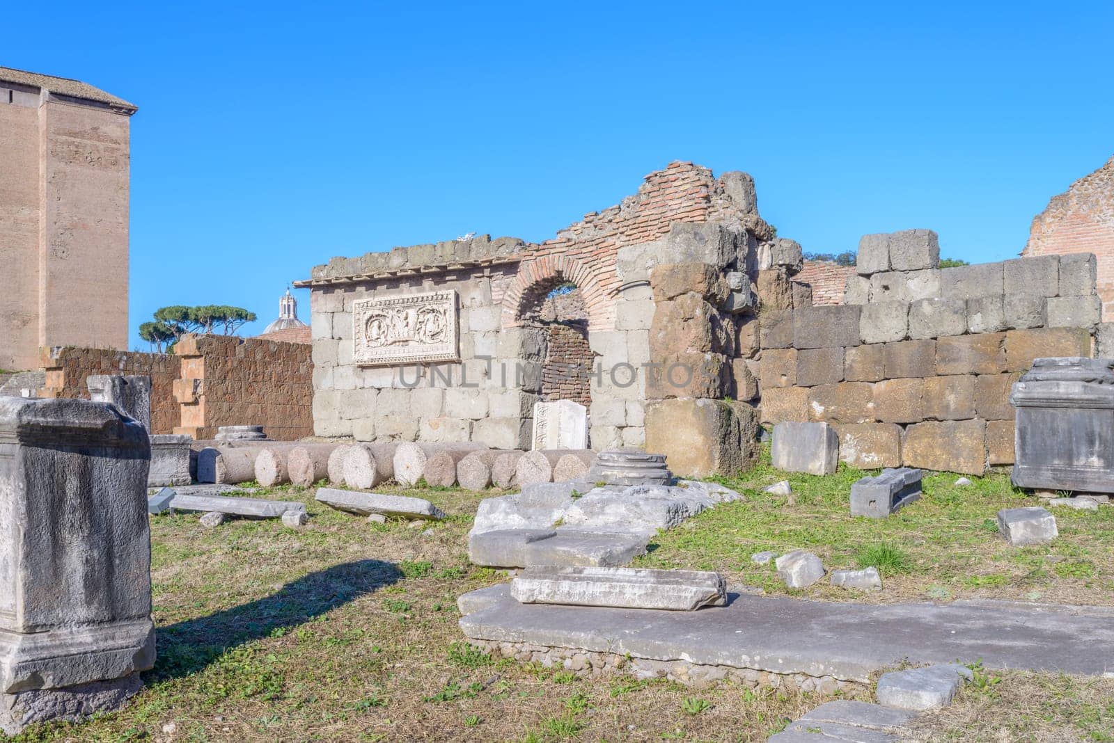 Ruins buildings and statue in the foro romano in Rome italy