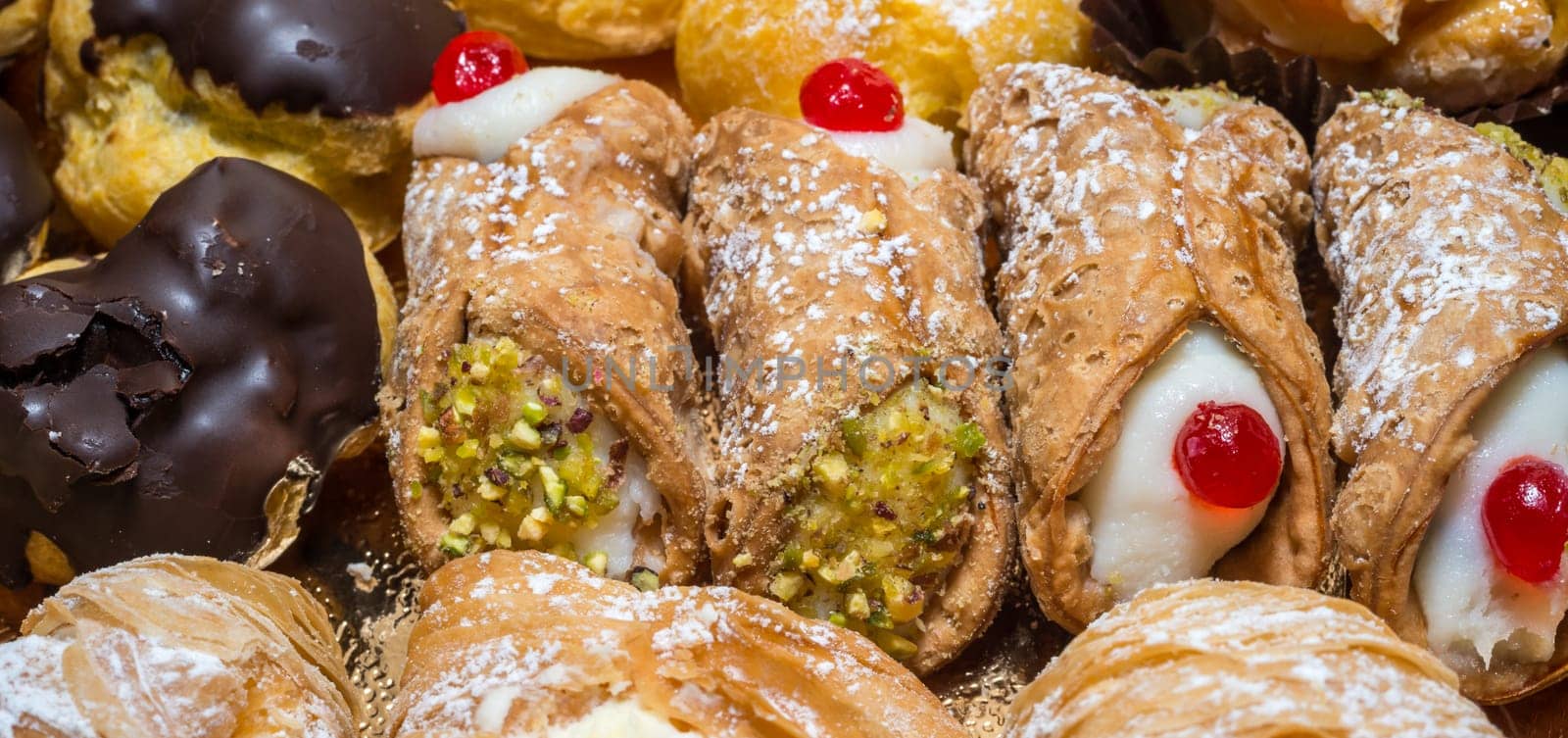 colorful pastries with fruits, cream and chocolate, the real Italian confectionery
