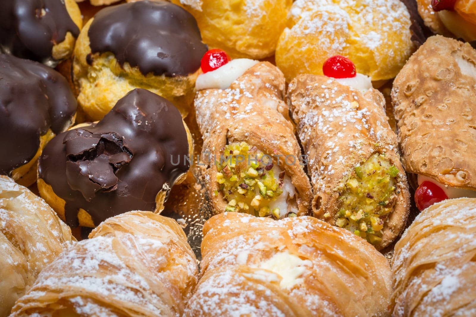 colorful pastries with fruits, cream and chocolate, the real Italian confectionery