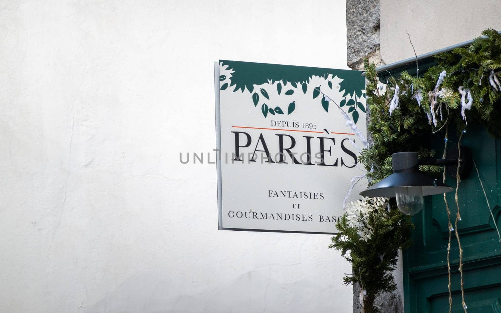 ESPELETTE, FRANCE - CIRCA JANUARY 2021: Paries sign outside shop. Paries is a chocolate, pastry, ice cream and confectionery maker from the French Basque Country.