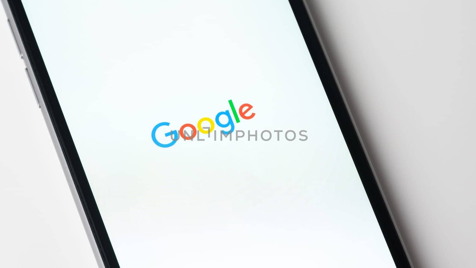 BAYONNE, FRANCE - CIRCA JANUARY 2021: Google app launching on Apple iPhone 6S. The google app gives access to the Google search engine.