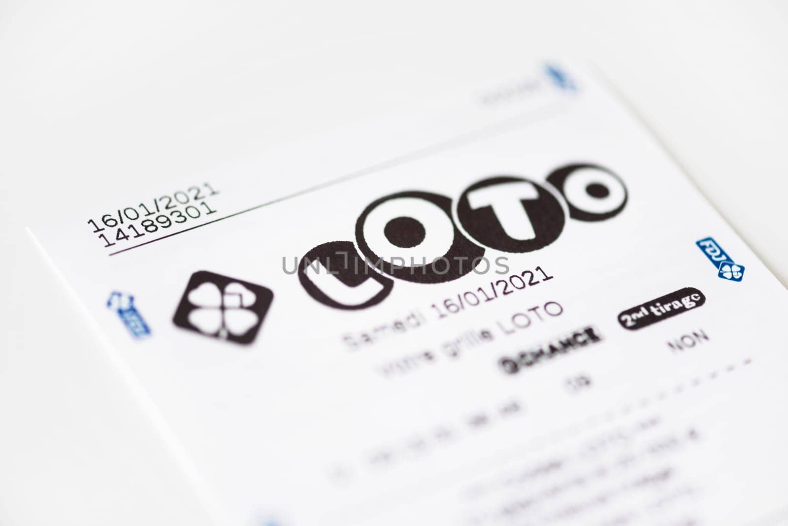 BAYONNE, FRANCE - CIRCA JANUARY 2021: Francaise des Jeux Loto receipt on white background. Loto is one of the games of Francaise des Jeux, France's national lottery operator.