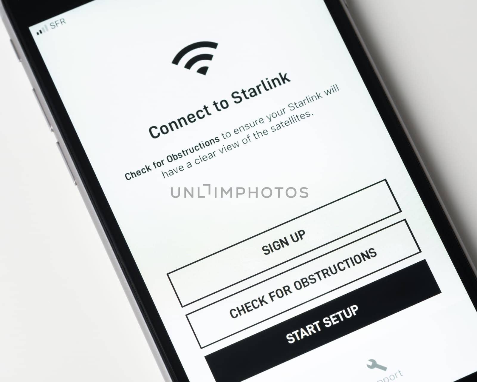 BAYONNE, FRANCE - CIRCA JANUARY 2021: Starlink app on Apple iPhone screen. Starlink is a satellite internet constellation being constructed by SpaceX to provide satellite internet access.