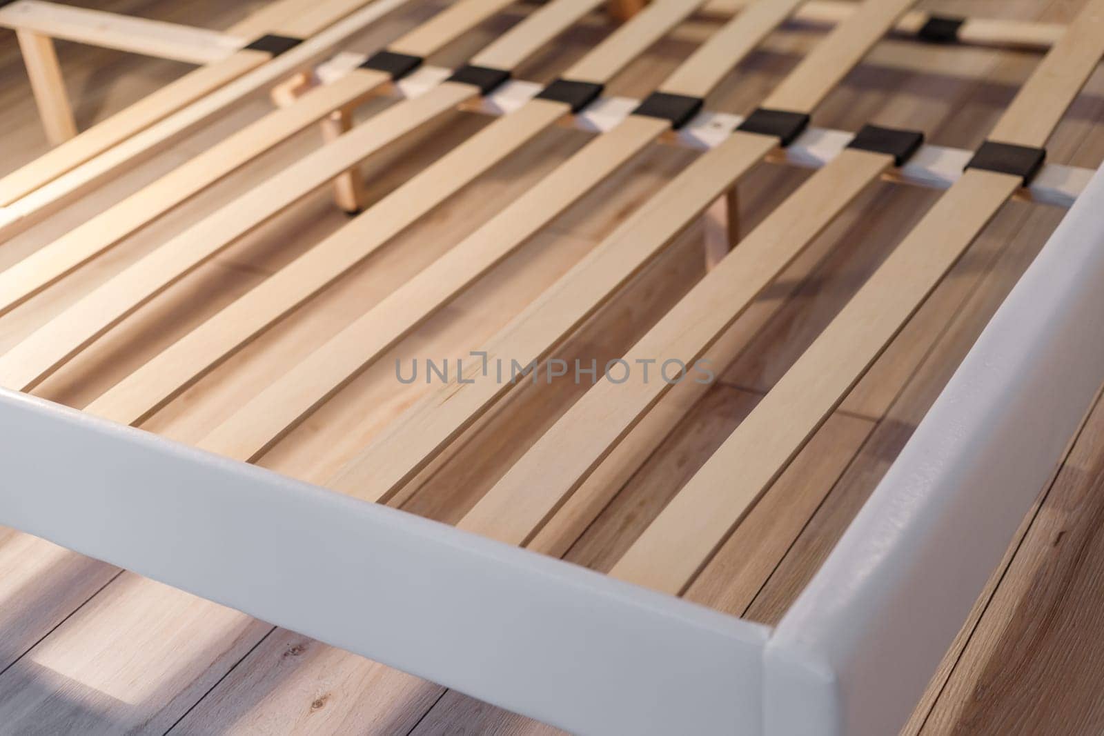 Wooden slats for arthopedic base of double bed. Interior structure of furniture.