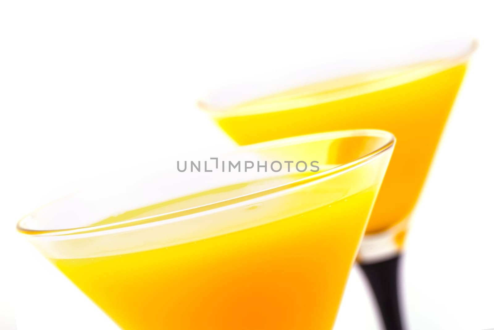 The Yellow Two Cocktail glasses  in white background