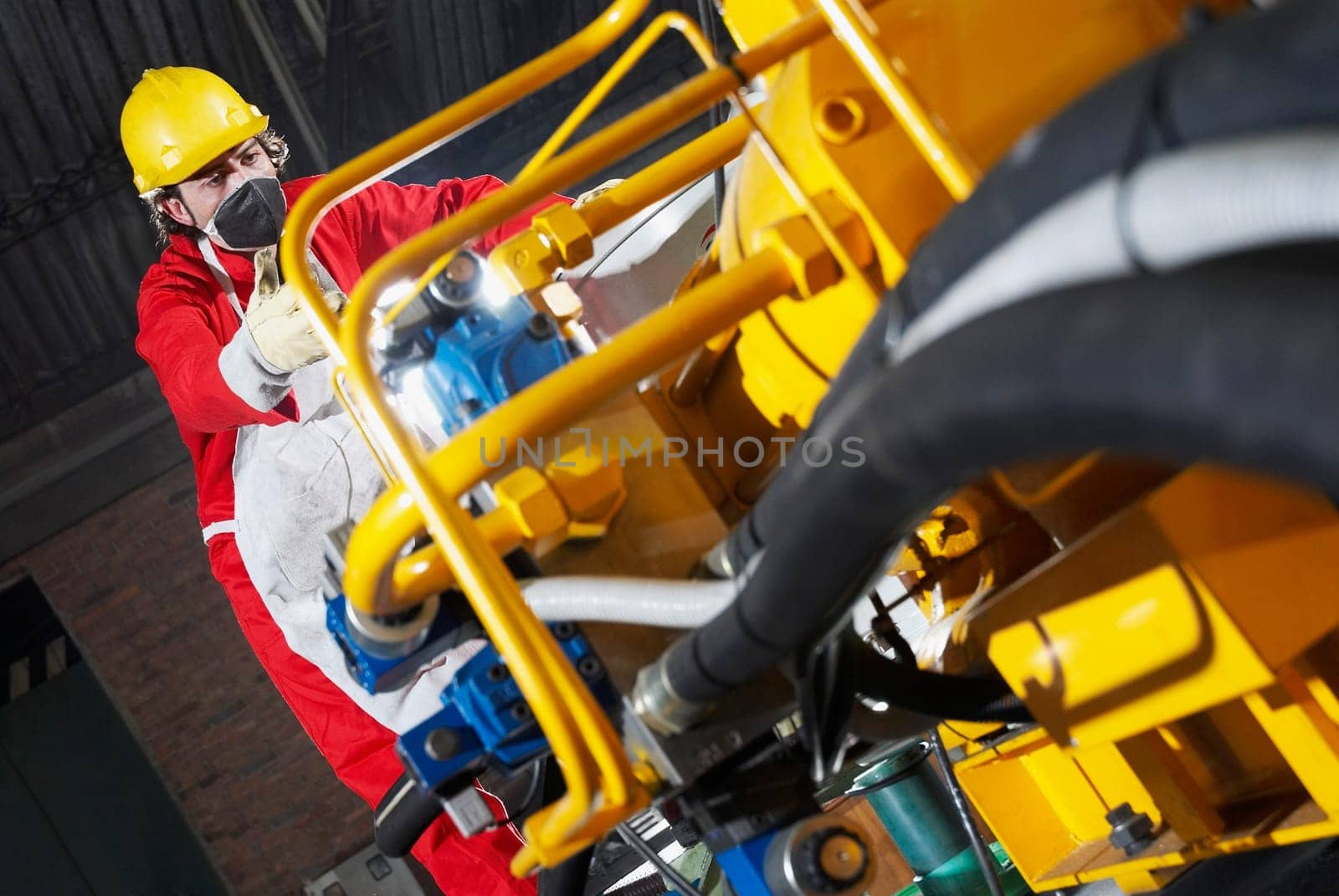 Low angle view of a technician working in a factory