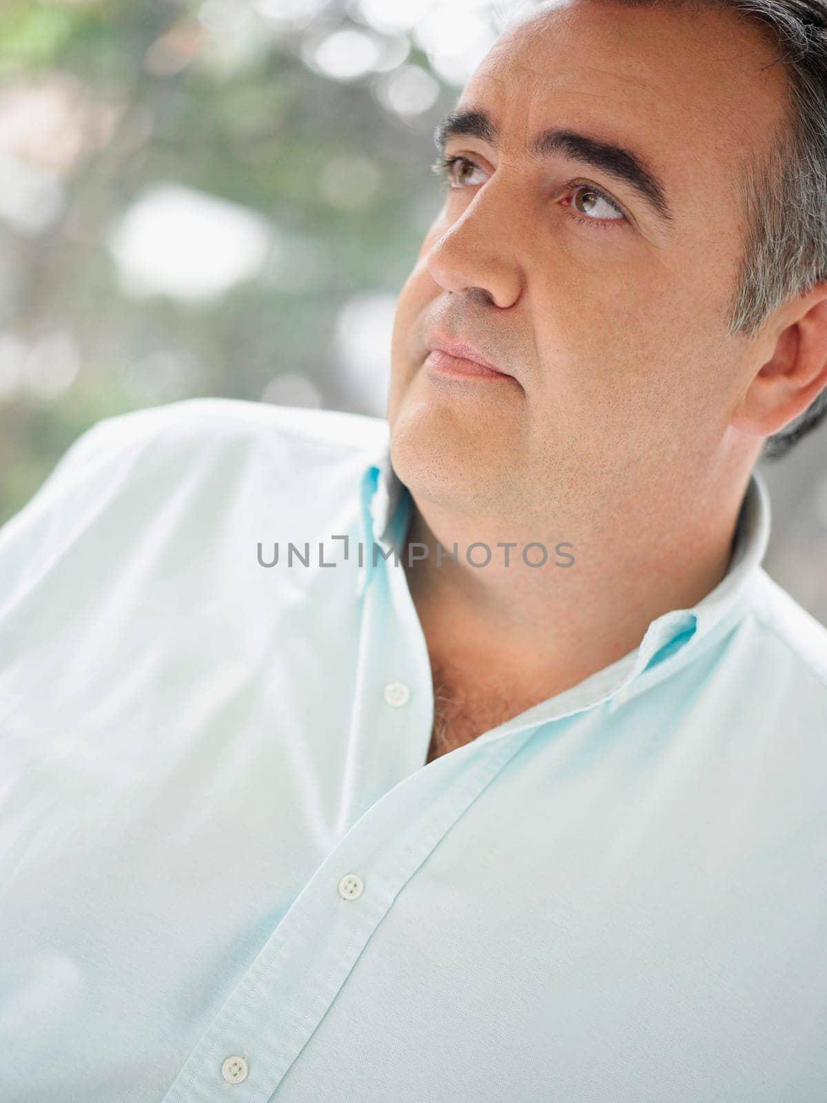 Close-up of a mature man looking away and thinking