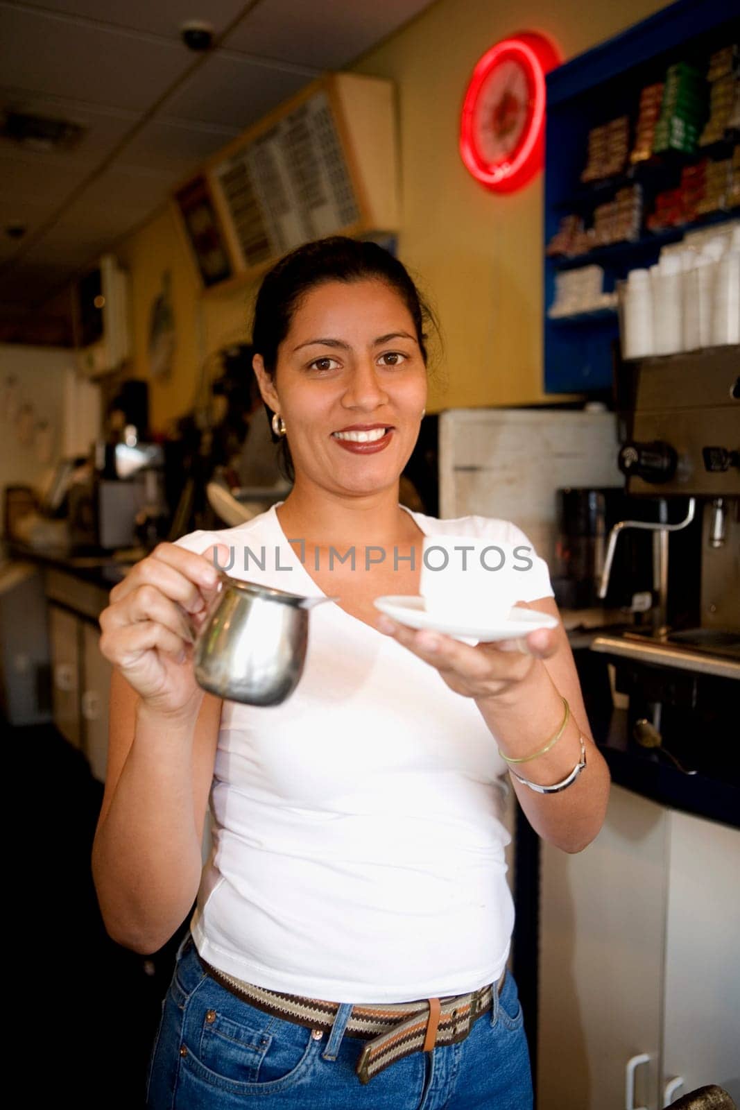 Portrait of a mid adult woman holding a mug and smiling