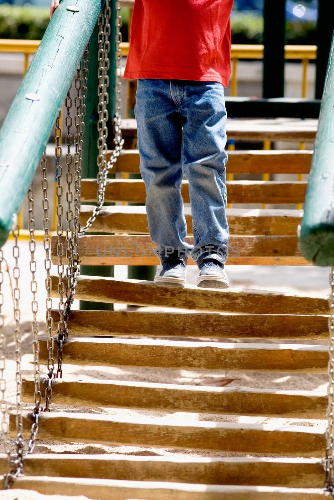 Low section view of a boy standing on a staircase