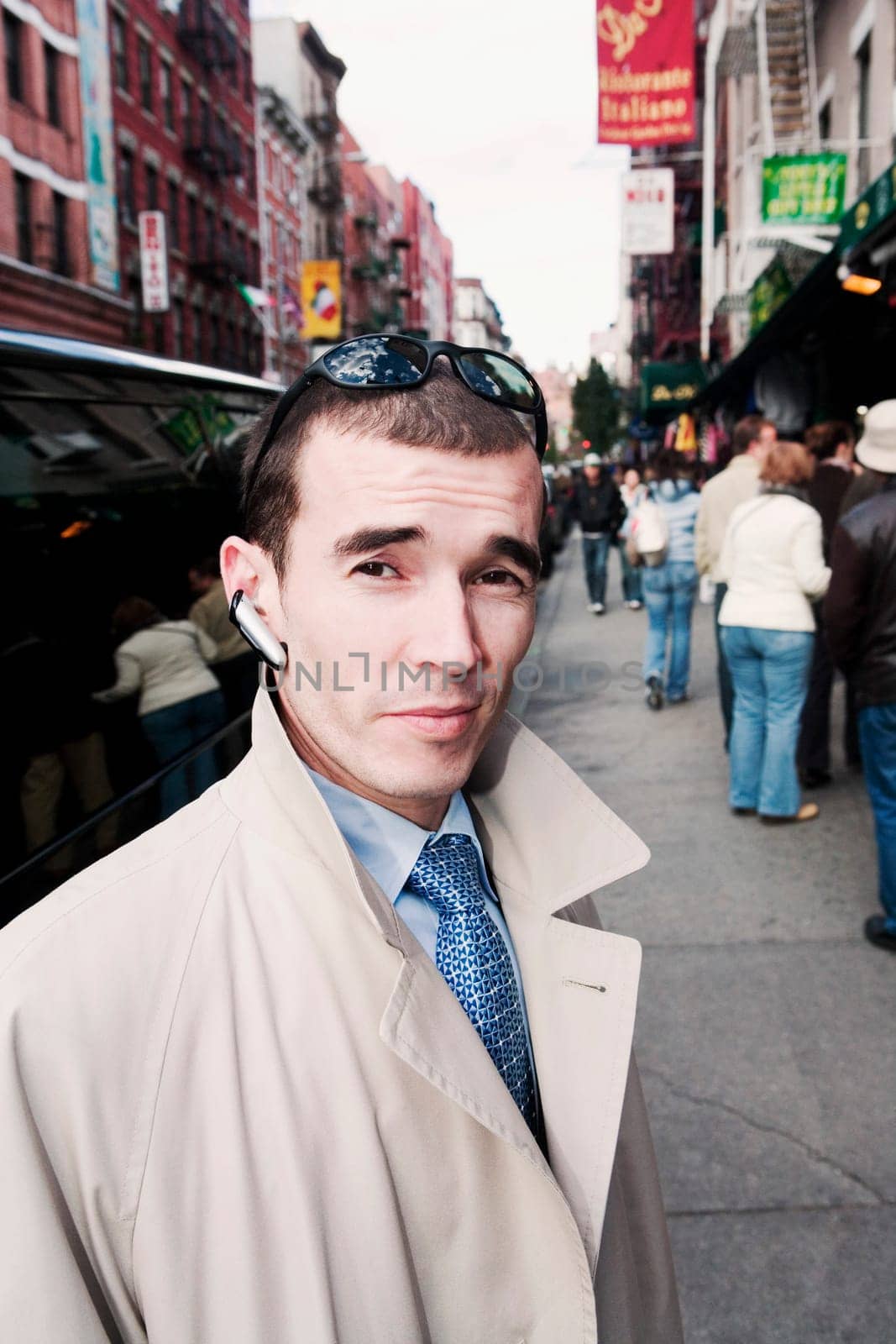 Portrait of a mid adult man wearing a hands free device