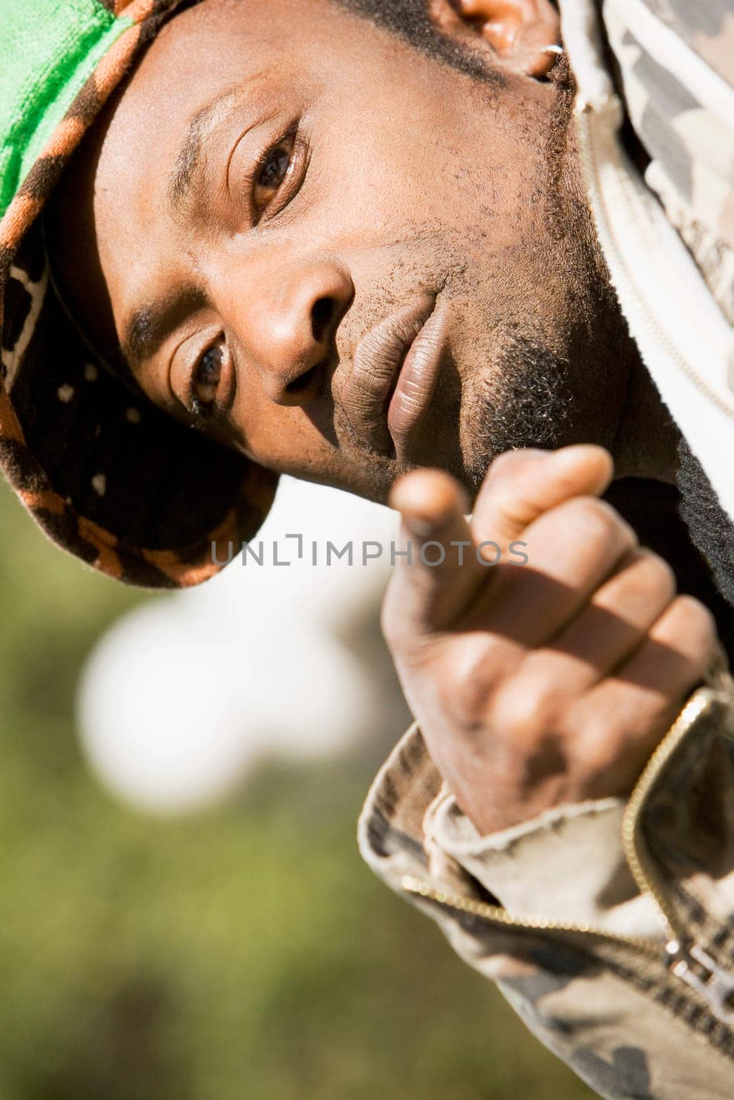 Portrait of a young man pointing forwards