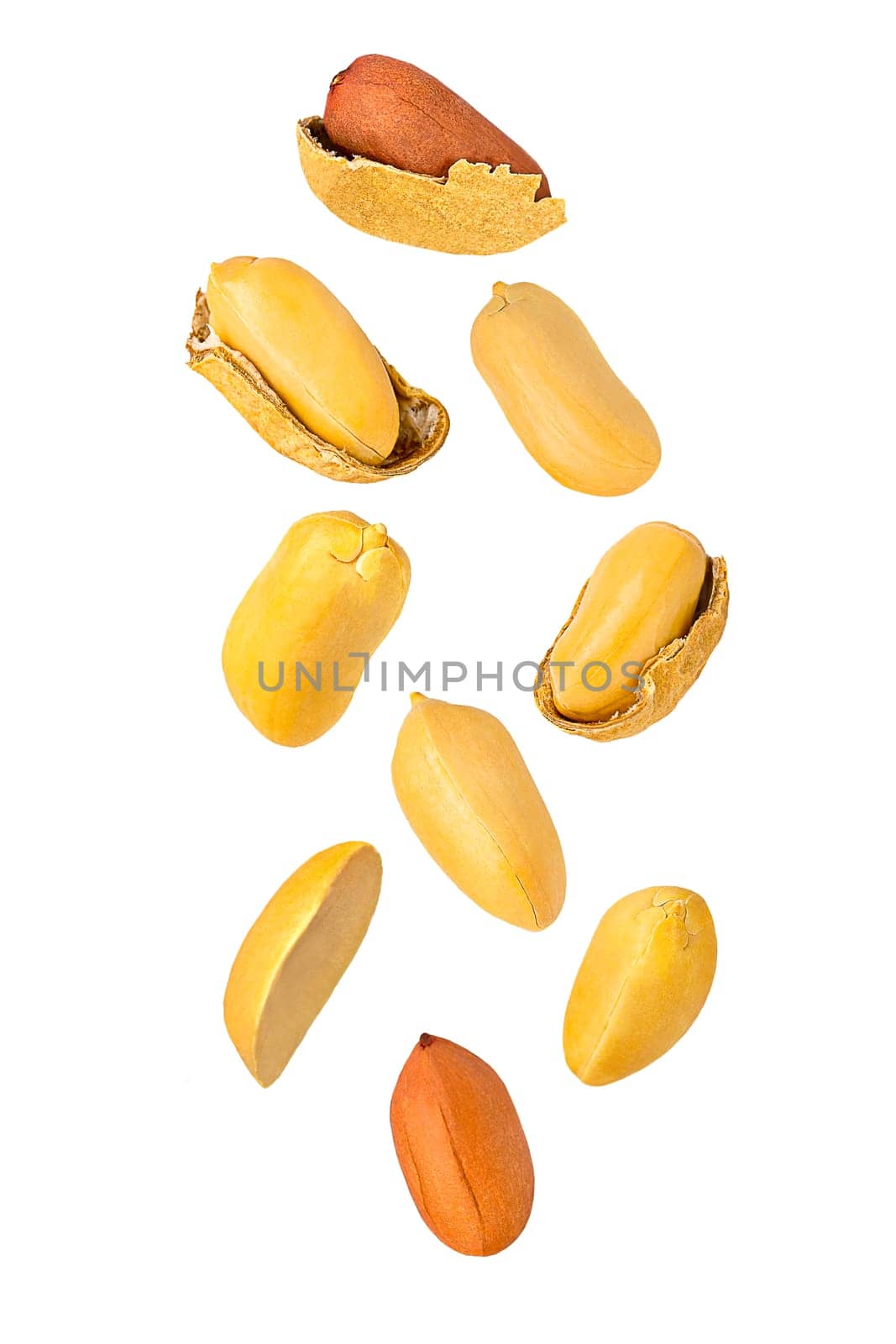 Isolated nuts. Nine flying peanuts witout shell on white with clipping path as package design element. Full depth of field. Food levitation concept.