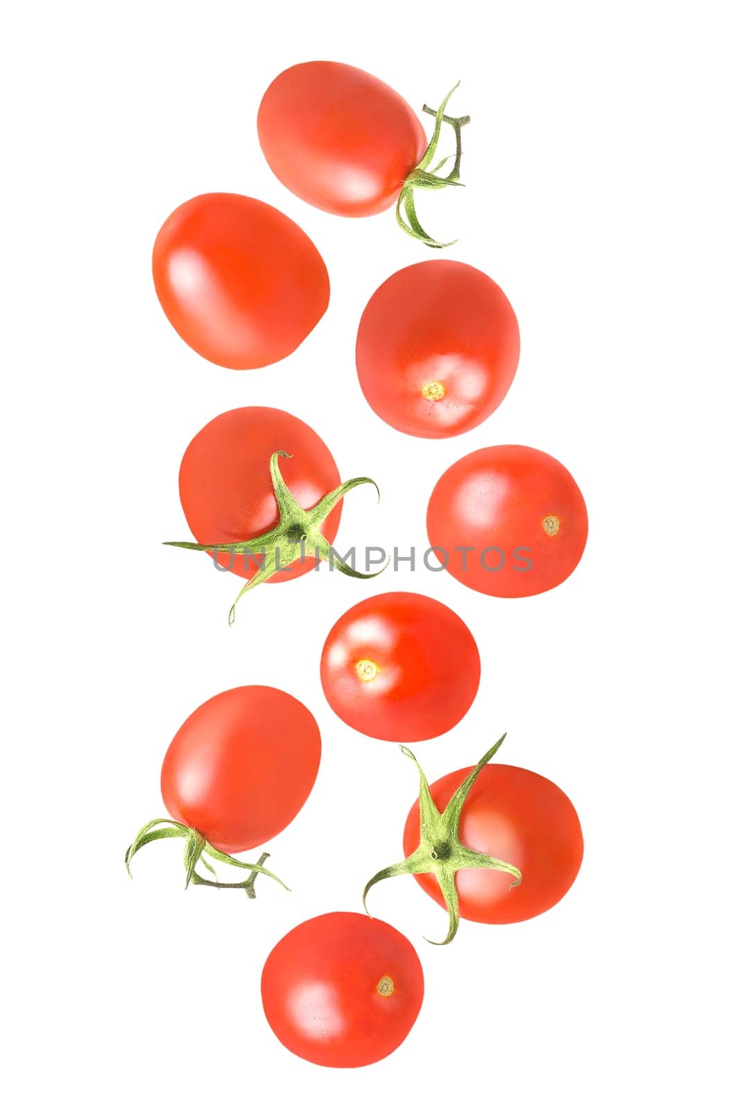 Isolated falling vegetables. Nine whole tomatoes in the air on white with clipping path as package design element. Full depth of field. Food levitation concept