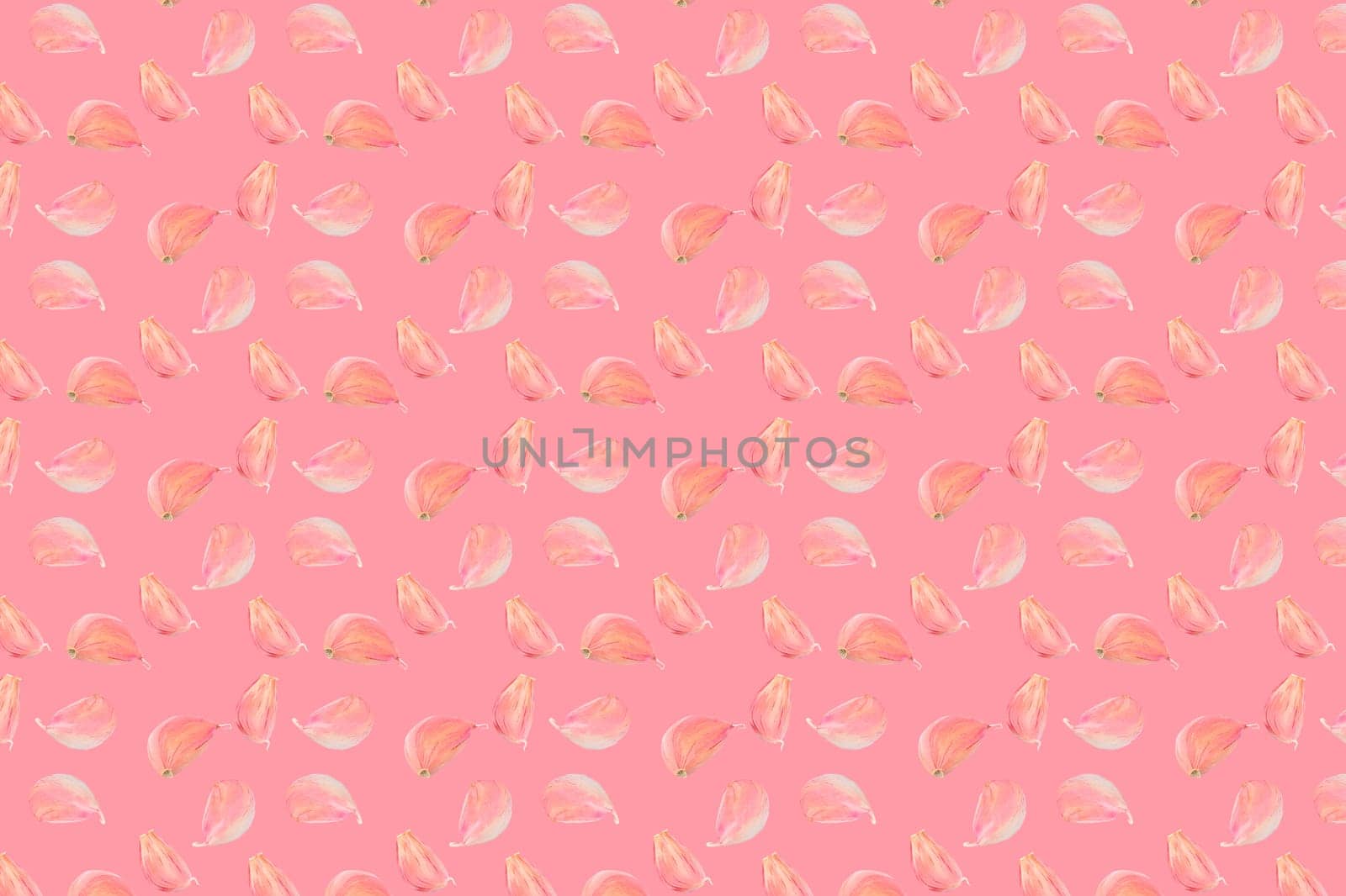 Seamless food pattern. Pink colour garlic cloves on colourful background. From above
