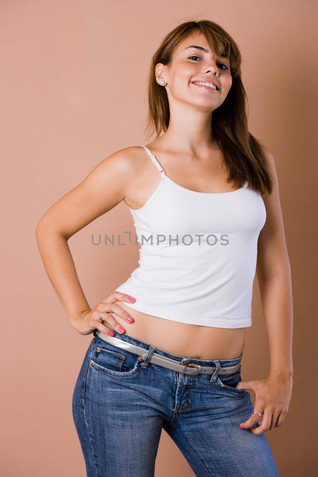 Portrait of young woman in jeans