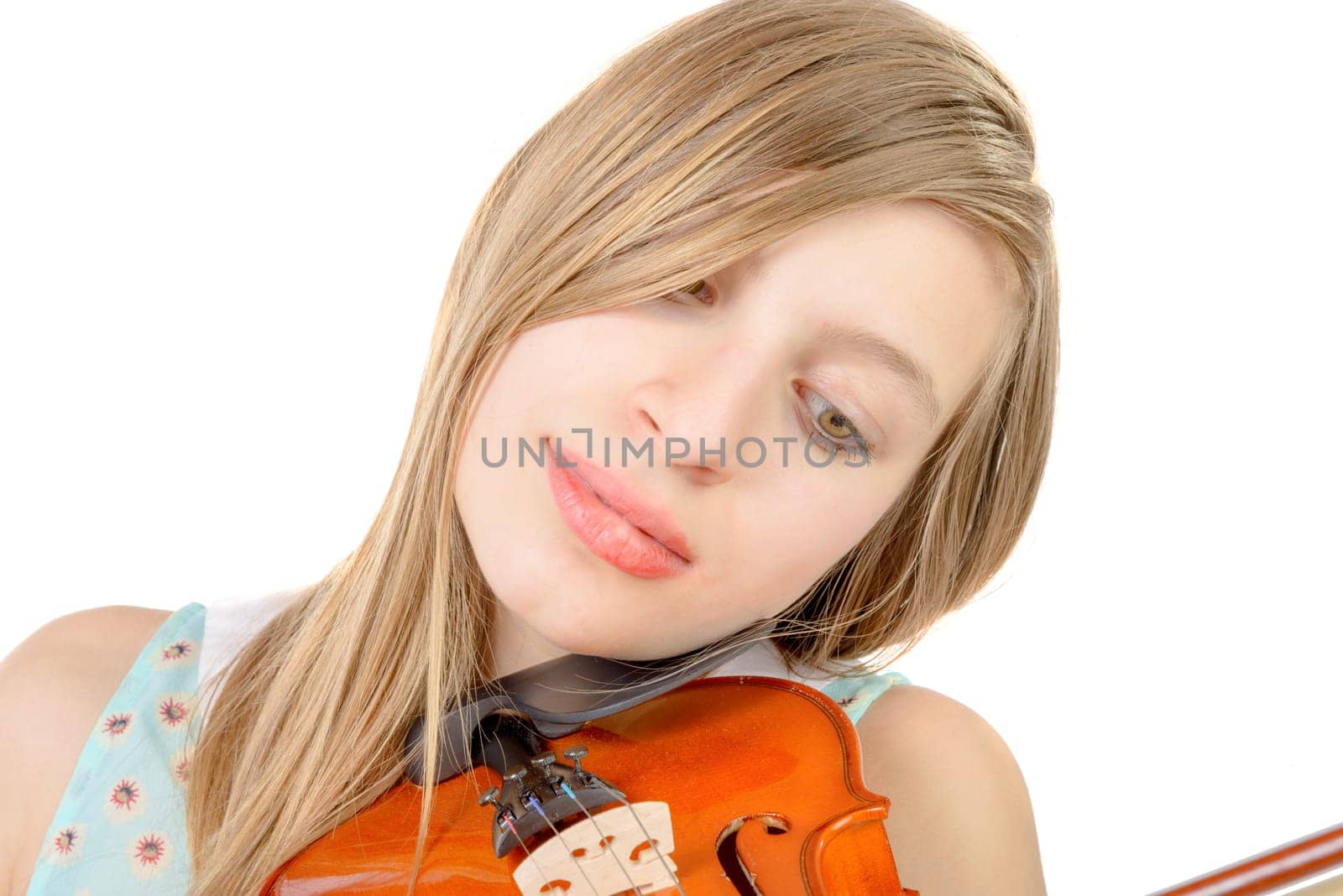 a teenage girl with long hair plays violin on the white background