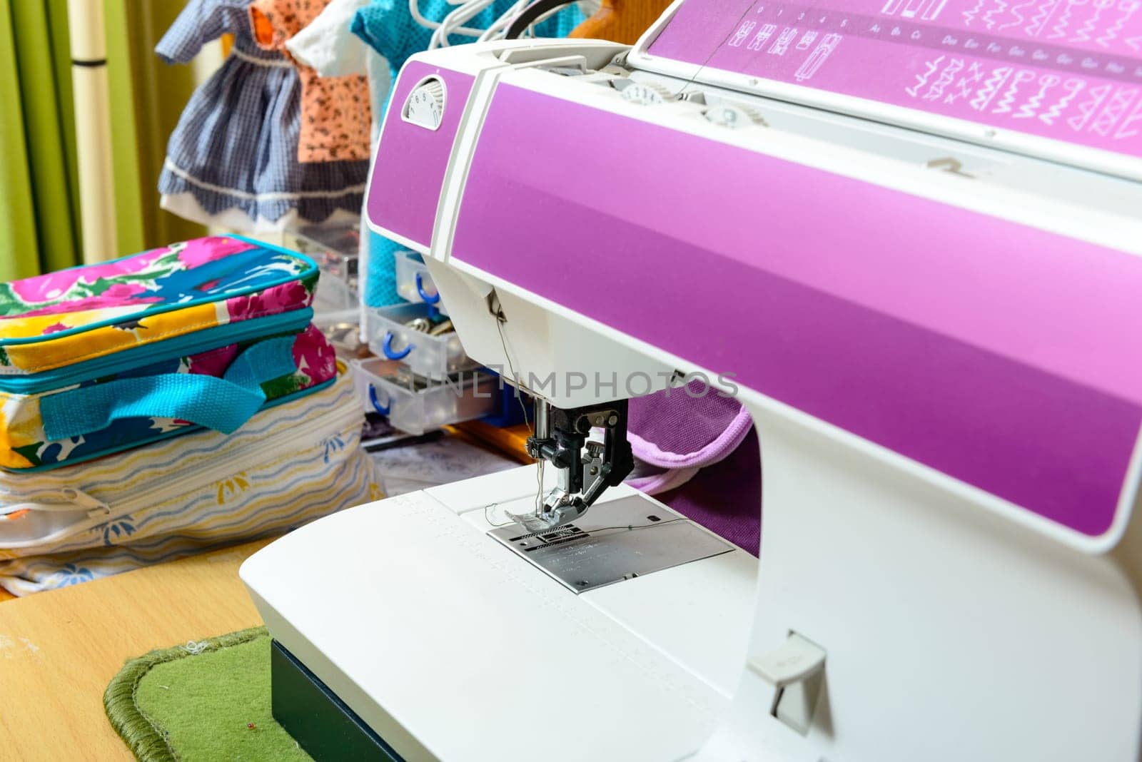 purple sewing machine in the workshop of a seamstress