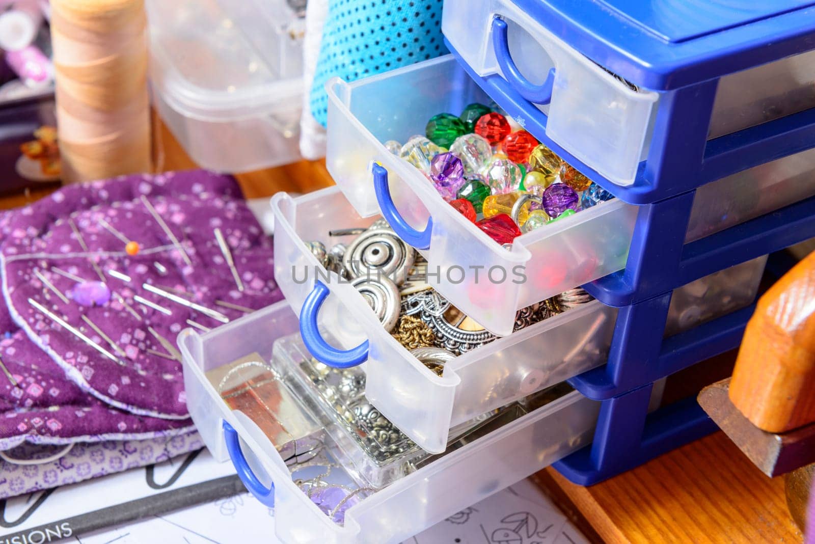 box filled with various buttons in the workshop of a dressmaker