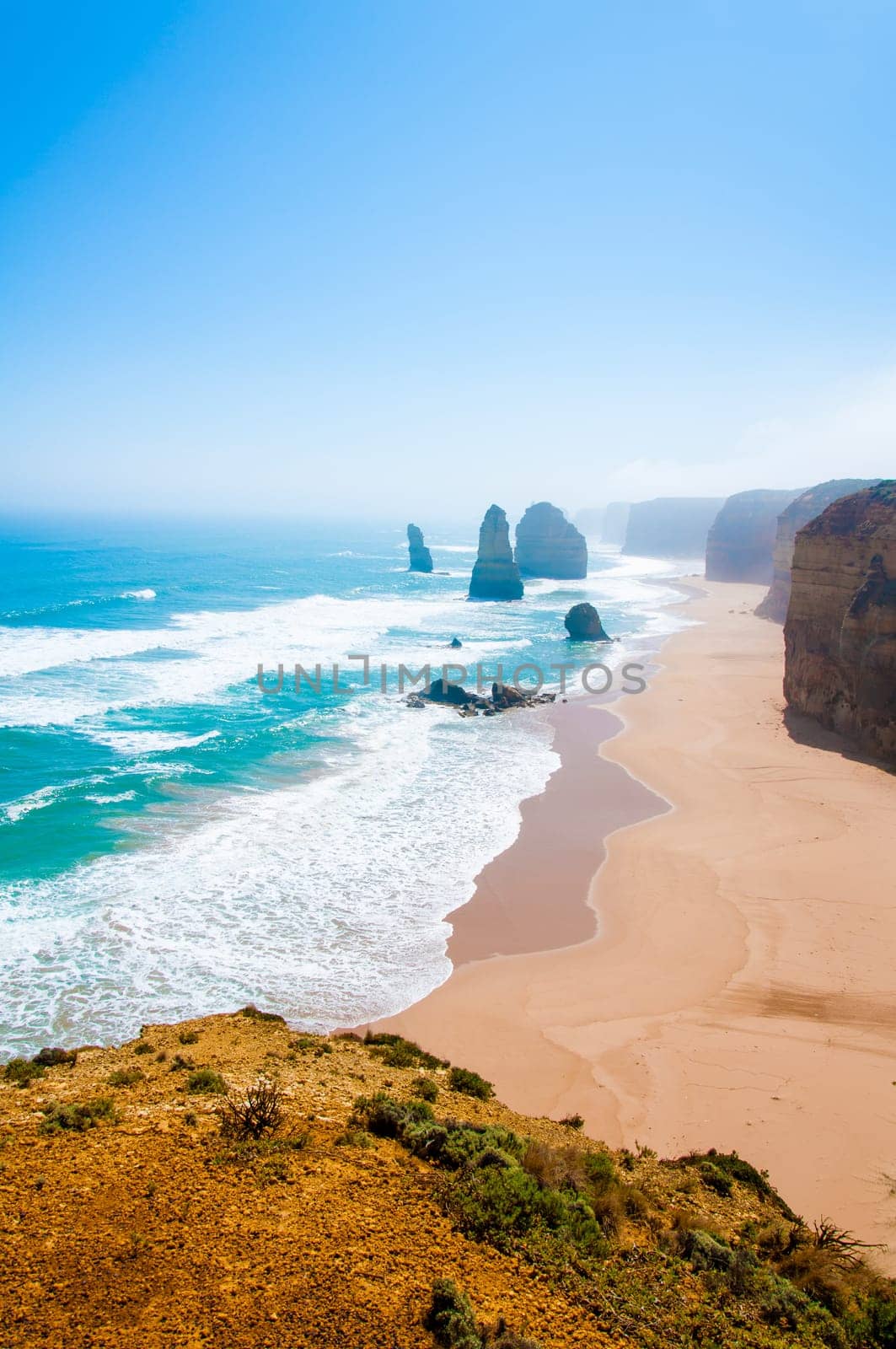 The Twelve Apostles, a famous collection of limestone stacks off the shore of the Port Campbell National Park, by the Great Ocean Road in Victoria, Australia